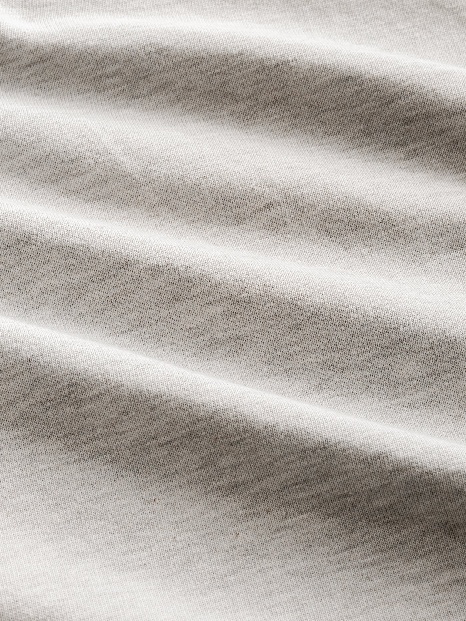 Grey short-sleeve jersey T-shirt from Sweats UK, styled flat with visible crew neckline and soft fabric texture.