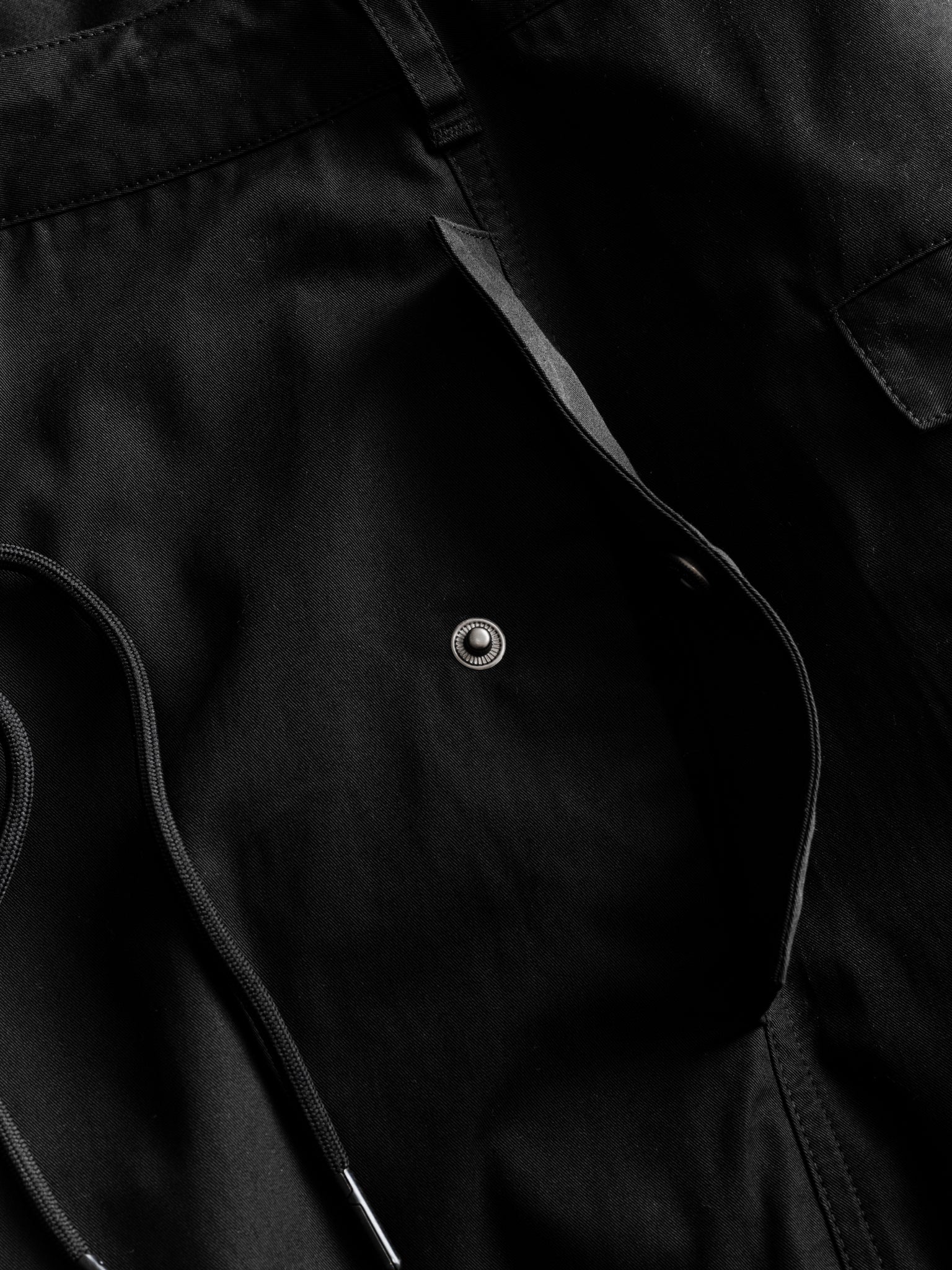 Black V3 Flight Pant by Sweats UK displayed flat, showing the relaxed fit and stylish design of these sporty men's joggers.