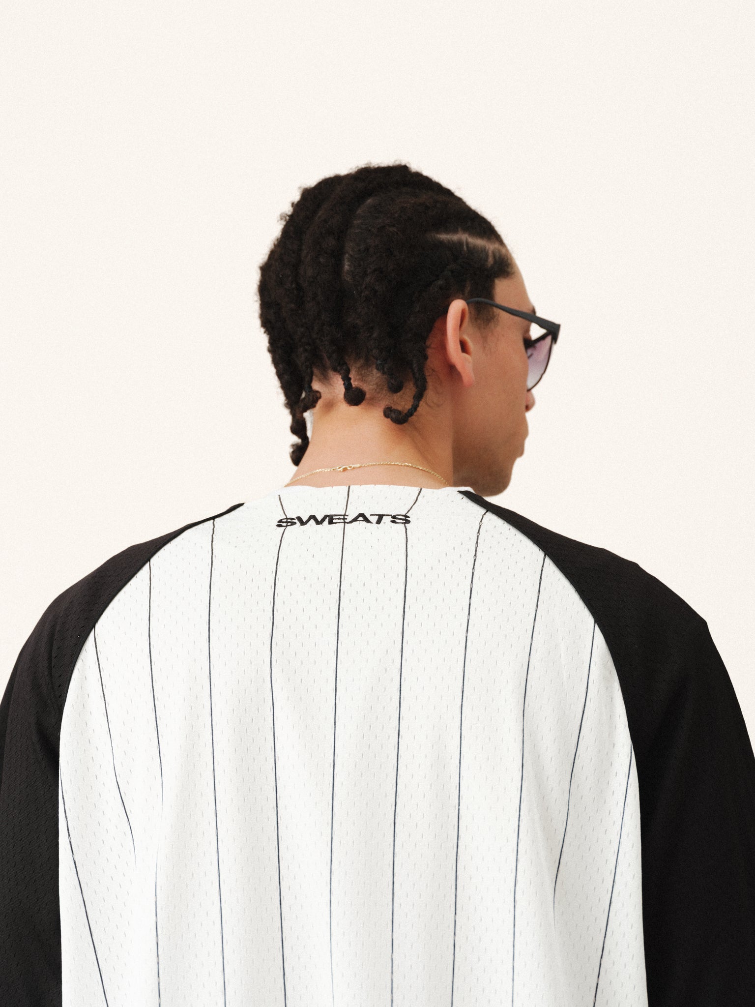 Stripe baseball jersey by Sweats UK with pinstripes, featuring a classic design and button-up front on a white background.