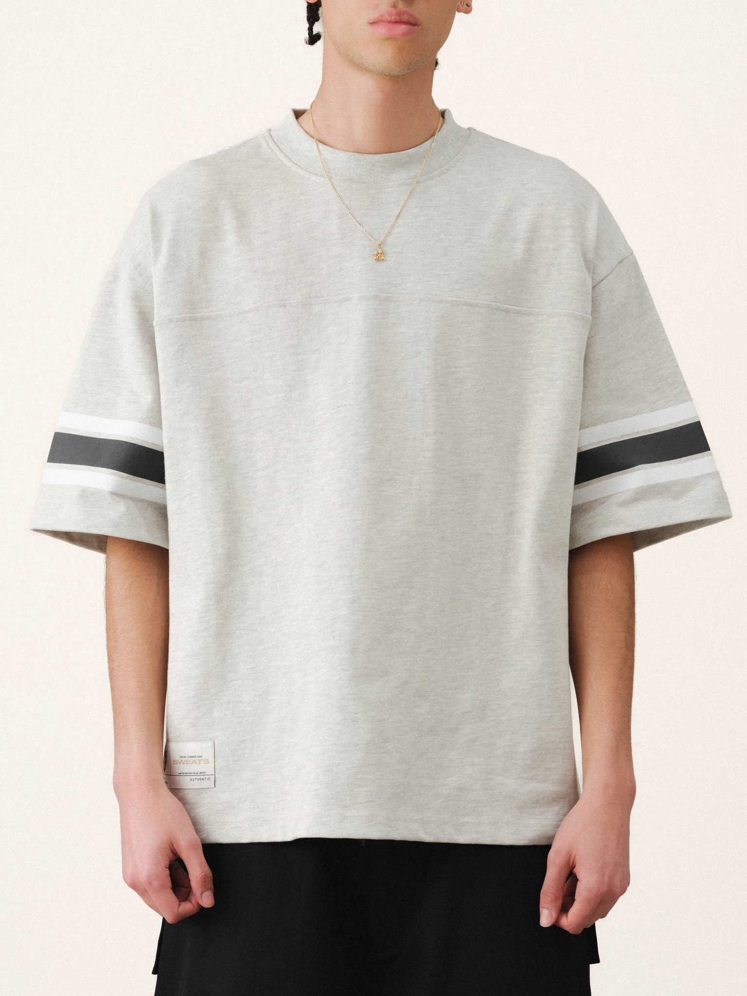 Light blue Arctyc Jersey SS T-Shirt by Sweats UK displayed on a hanger, featuring a classic crew neck and smooth fabric.