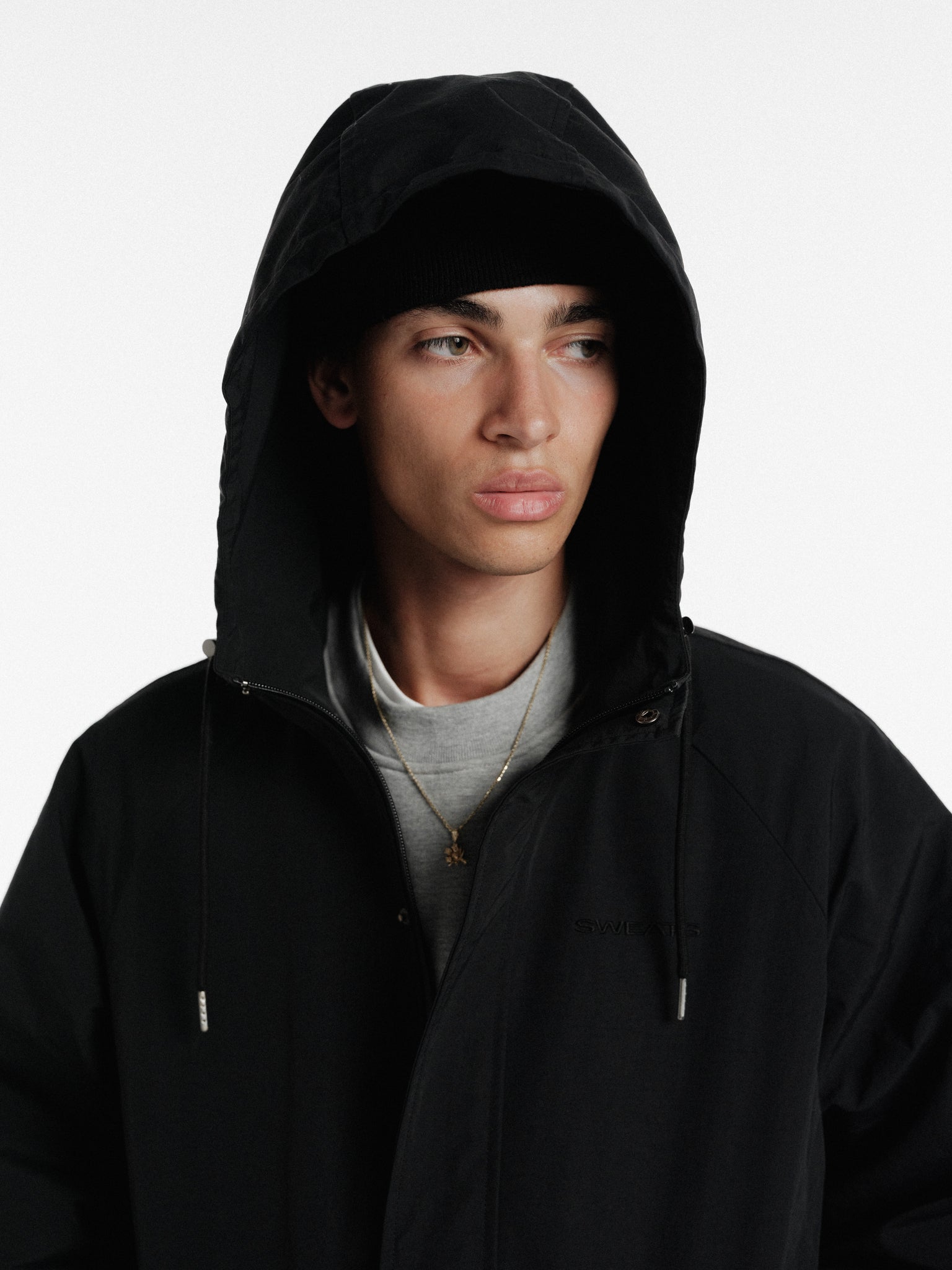 Black ARC jacket by Sweats UK with a sleek design, featuring a front zipper and stylish fit for winter wear.