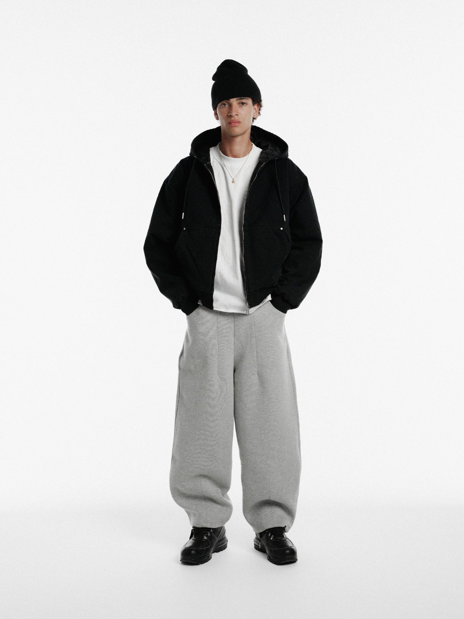 Washed black workwear hoodie from Sweats UK with durable fabric and front pocket, ideal for work and casual wear.