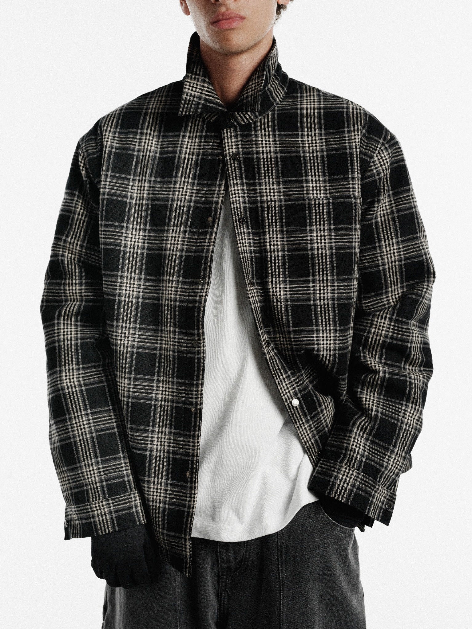Black flannel jacket by Sweats UK, featuring a cozy button-up design and classic plaid pattern.