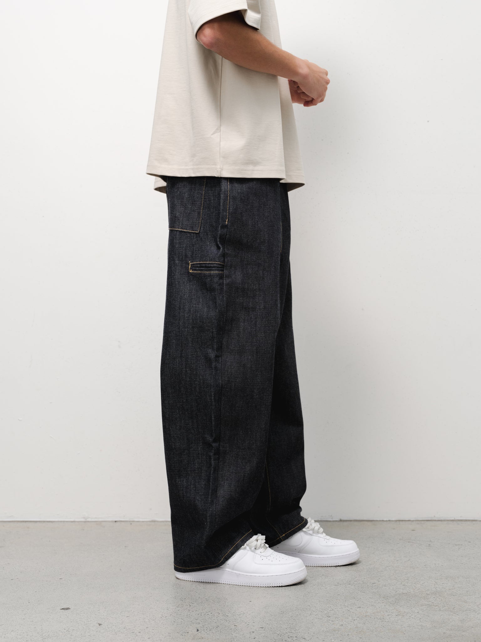 Light blue denim baggy jeans by Sweats UK with a relaxed fit, displayed on a neutral background.