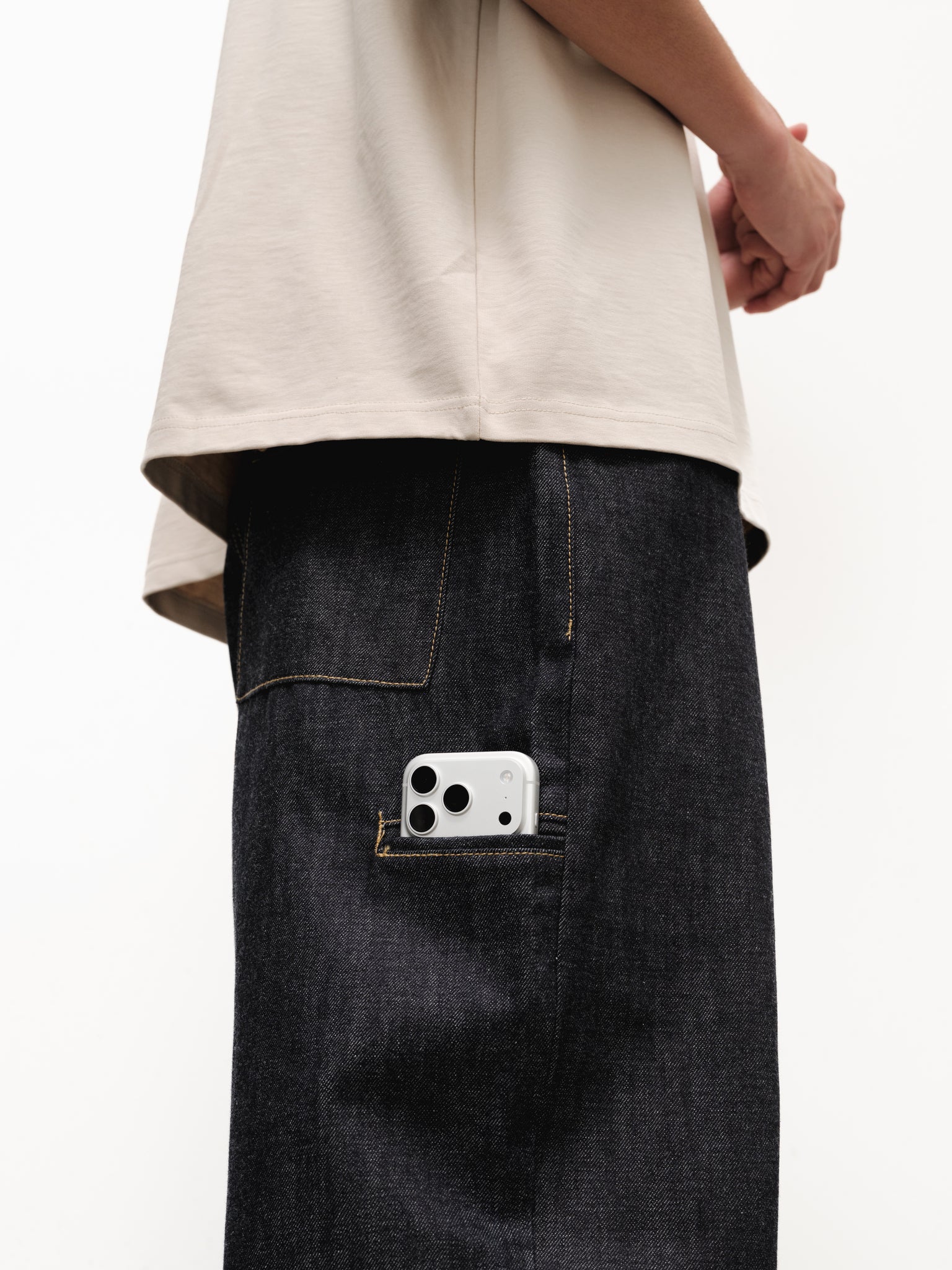 Pair of indigo denim baggy jeans from Sweats UK, showing relaxed fit and classic five-pocket style on a plain background.