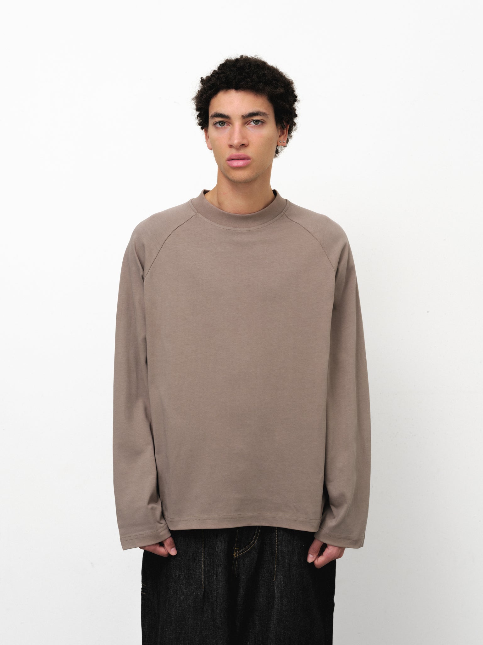 Long sleeve T-shirt by Sweats UK in dusty color, shown on a model with a casual fit and soft fabric texture.