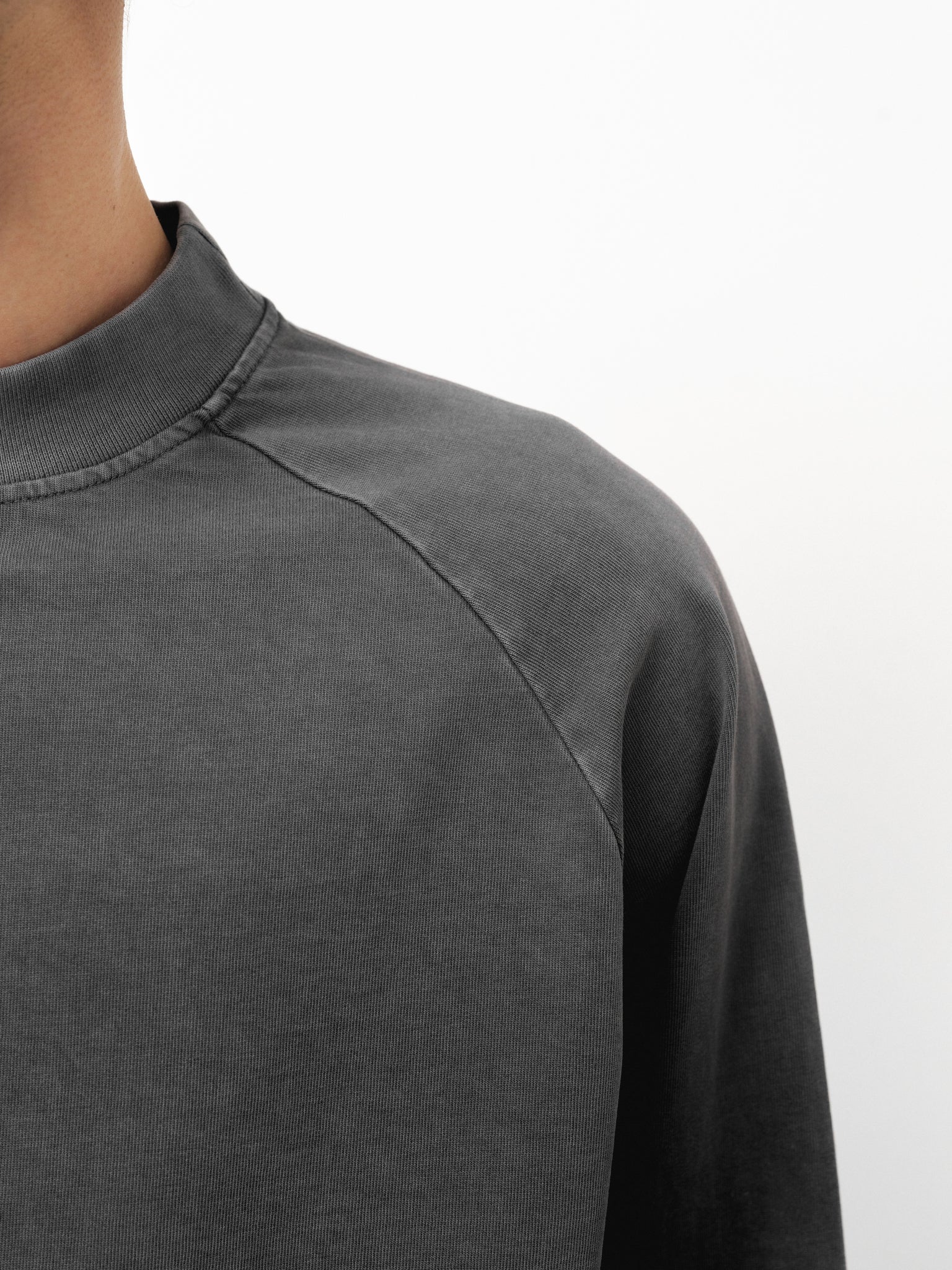 Washed grey long sleeve T-shirt by Sweats UK displayed on a model, showcasing casual fit and soft fabric texture.