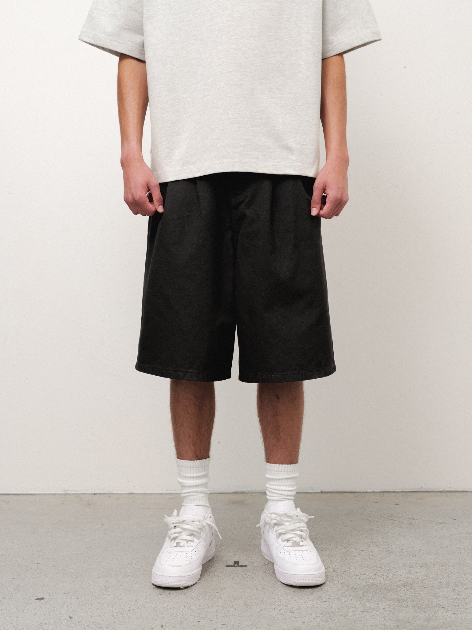 Black workwear shorts by Sweats UK, showing durable fabric and practical design for industrial or casual work environments.