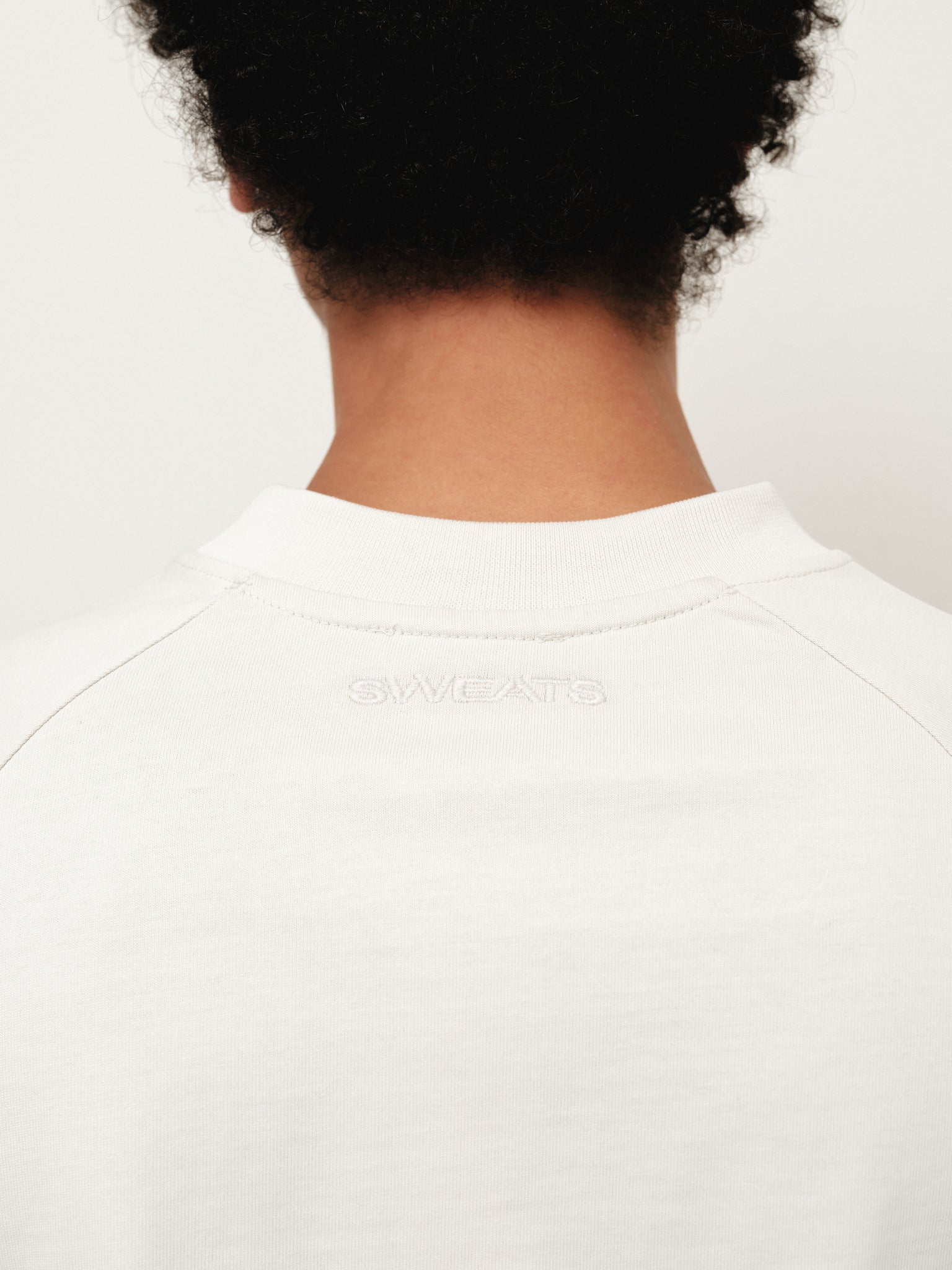 Long sleeve chalk T-shirt by Sweats UK, shown flat with front view and soft fabric texture.