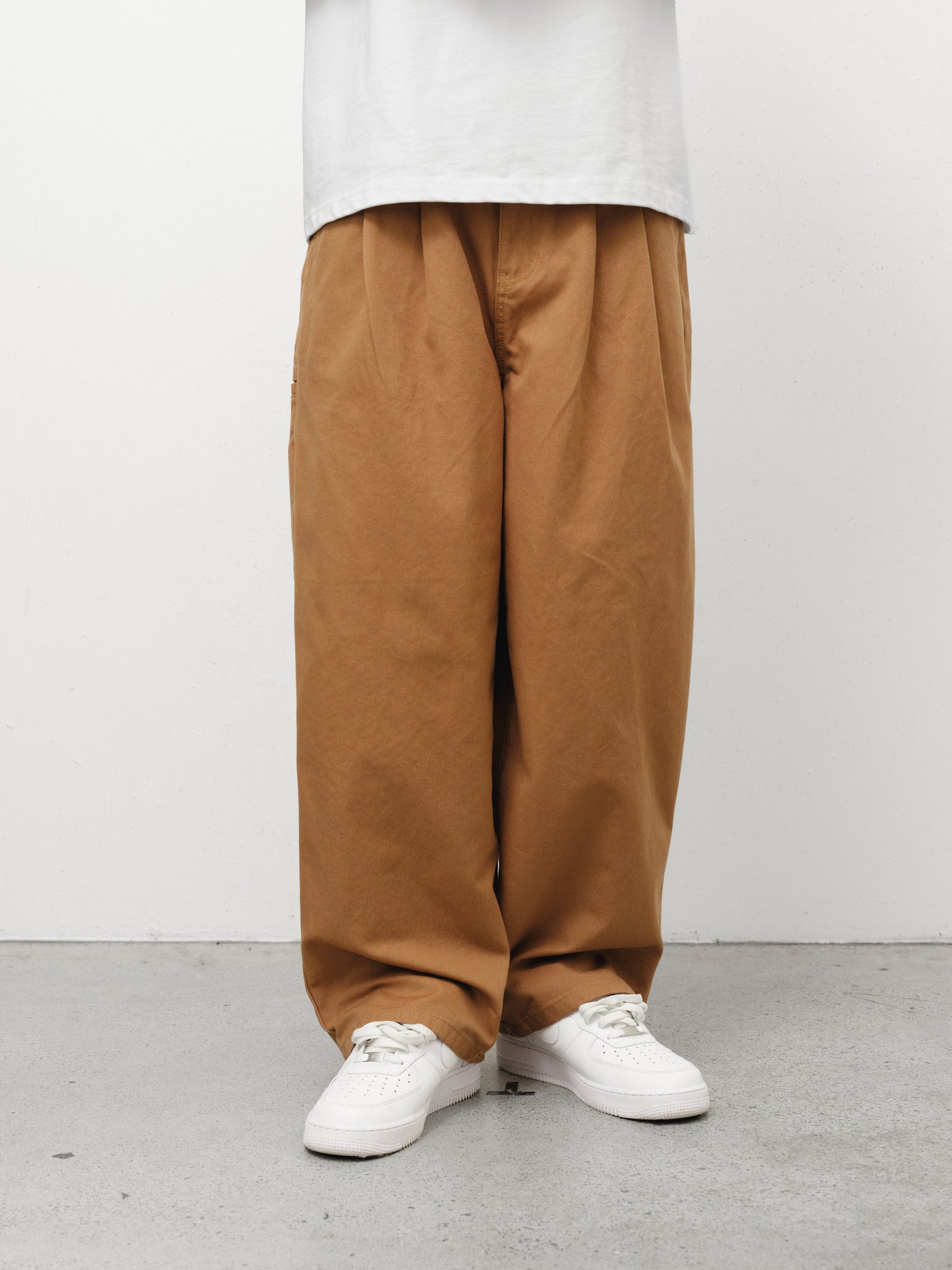 Tan workwear pants by Sweats UK displayed in a full stock shoot image. Durable, comfortable workwear for industrial jobs.
