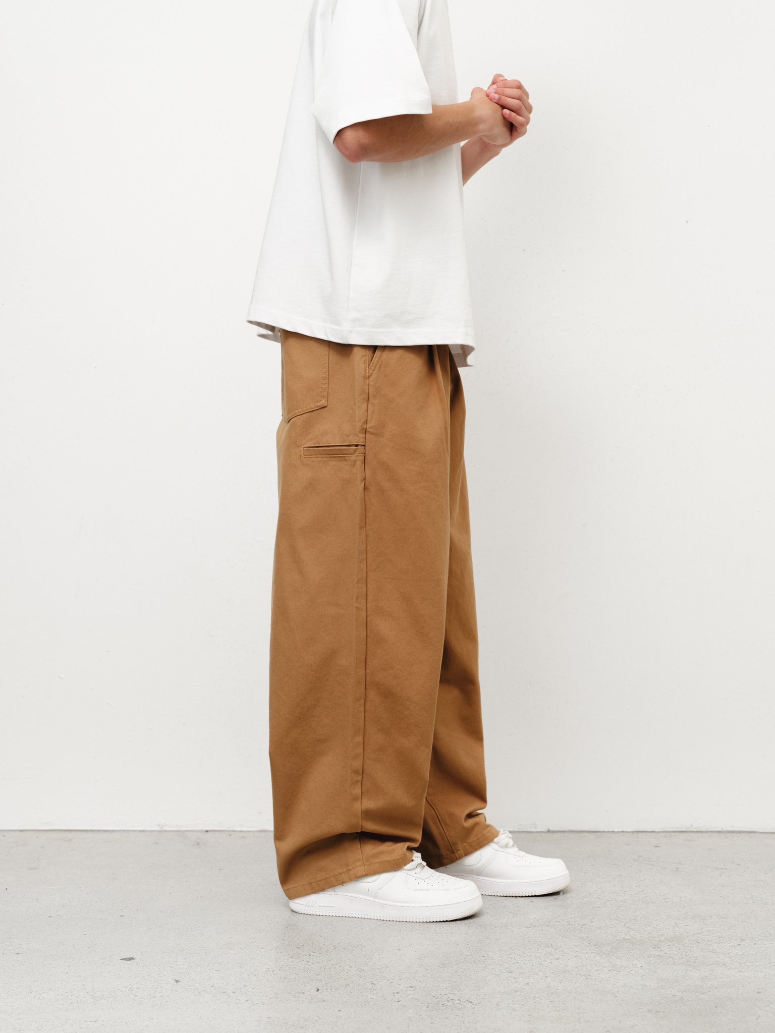 Tan workwear pants from Sweats UK, full-length with durable fabric and practical design for industrial or casual use.