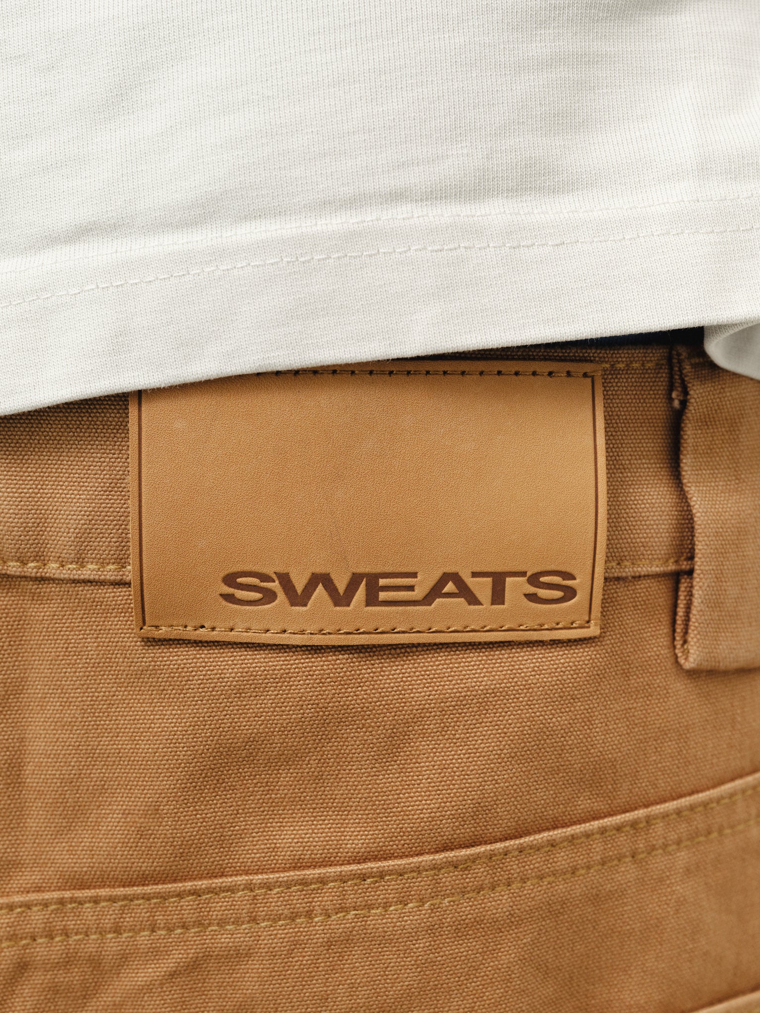 Tan workwear shorts by Sweats UK, featuring durable fabric and practical design, shown in a full-stock shooting image.