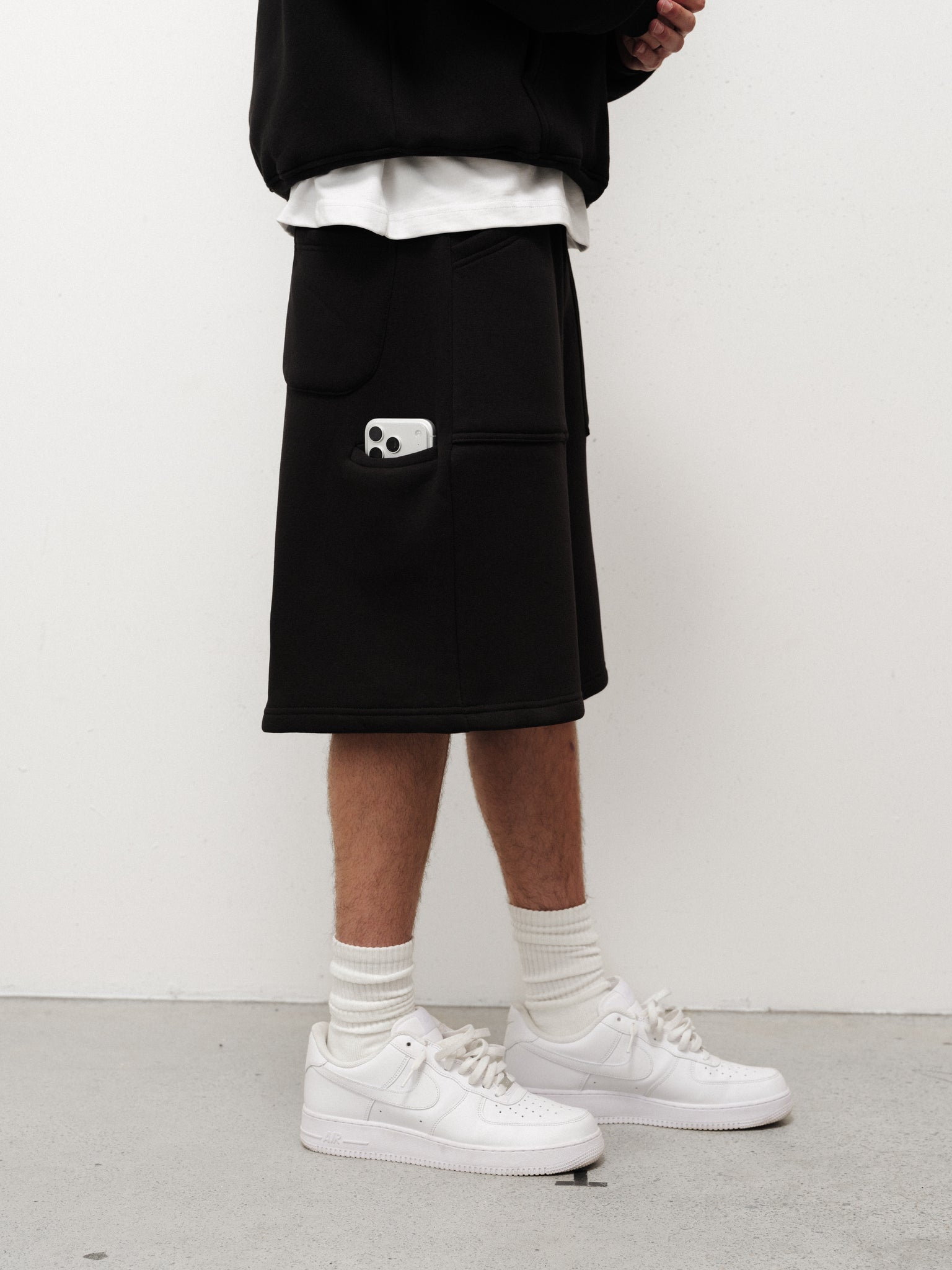 Black cozy shorts from Sweats UK with a relaxed fit, soft fabric, and comfortable waistband, perfect for casual wear.