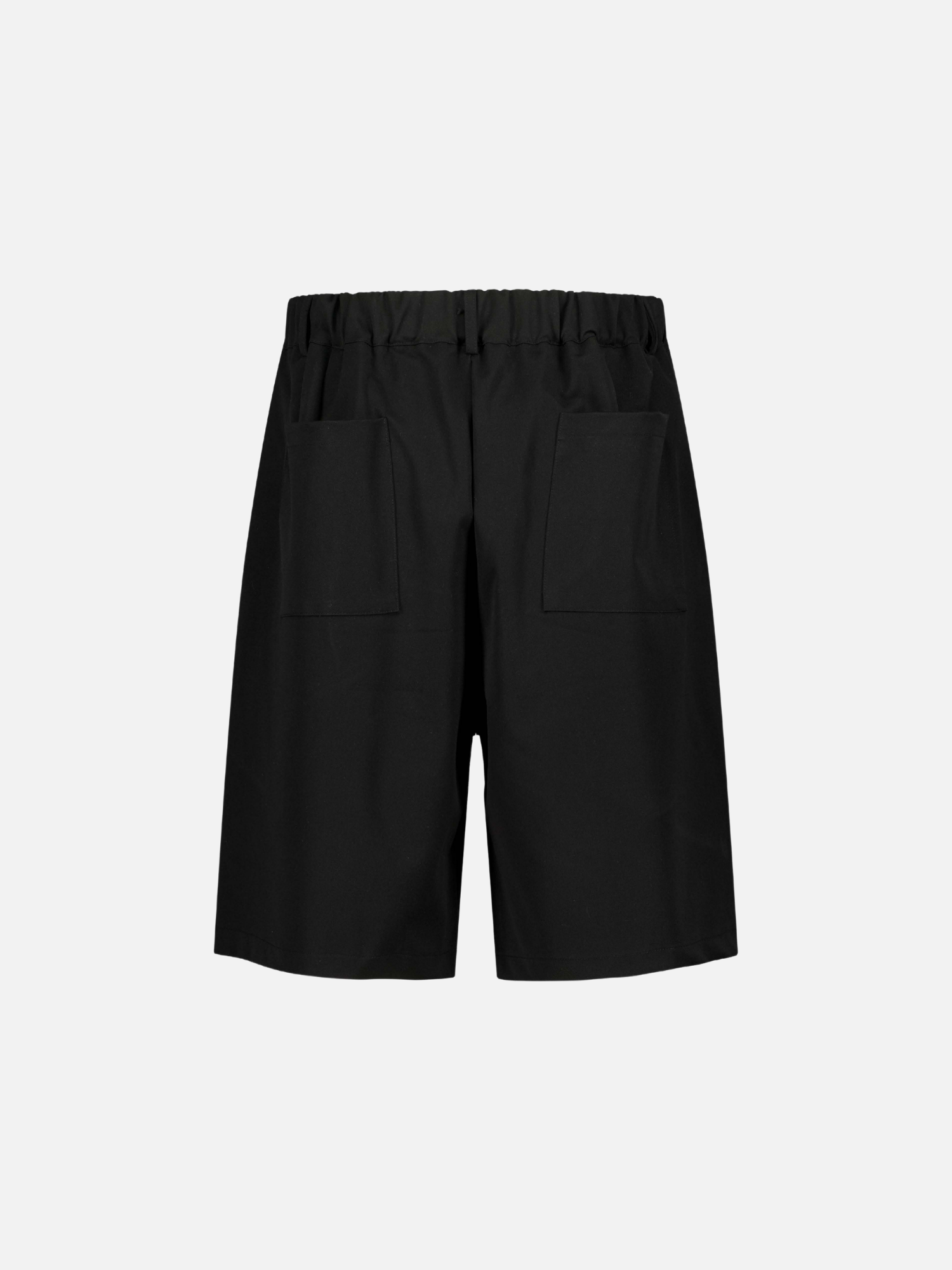 Back view of black pleated shorts by Sweats UK, showcasing the stylish pleats and relaxed fit for casual wear.