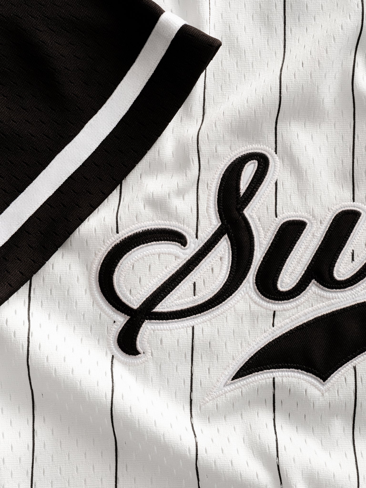Sweats UK pinstripe baseball jersey displayed flat with front view, featuring classic design and contrasting sleeve details.