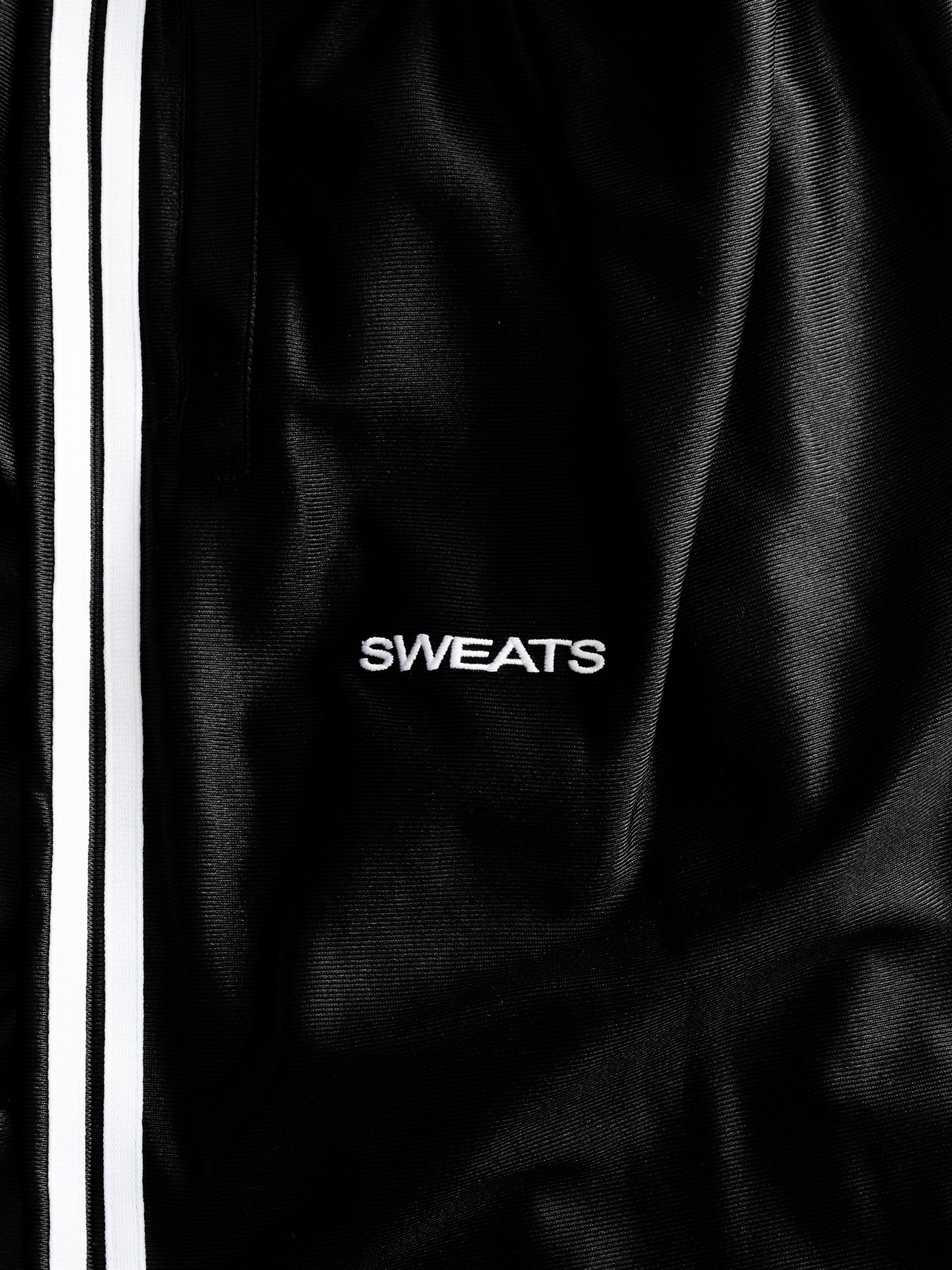 Black League Shorts by Sweats UK displayed flat with elastic waistband and sporty design, perfect for casual and athletic wear.