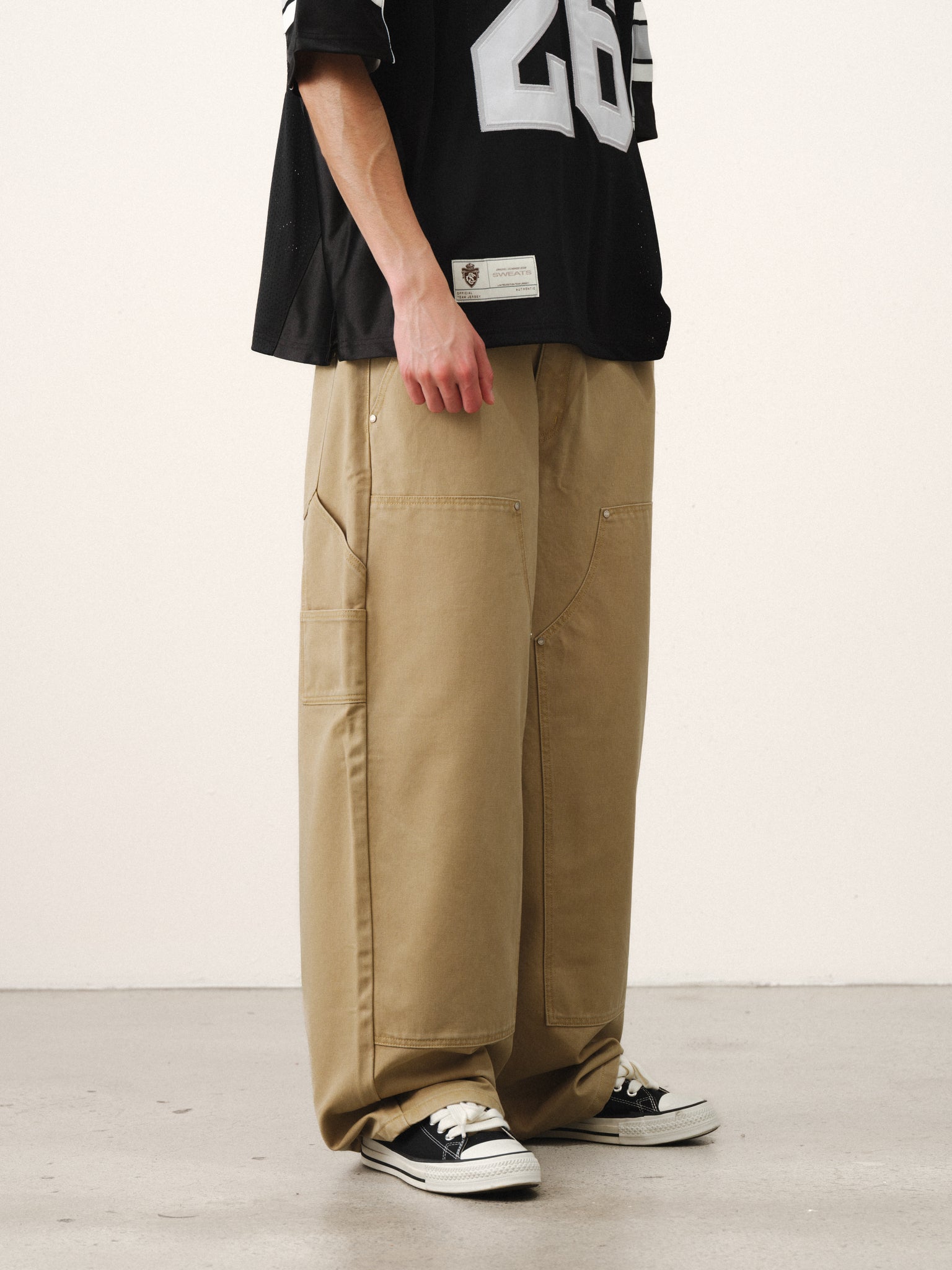 Sand-colored double knee pants by Sweats UK, featuring a relaxed fit and double knee design, perfect for casual summer wear.