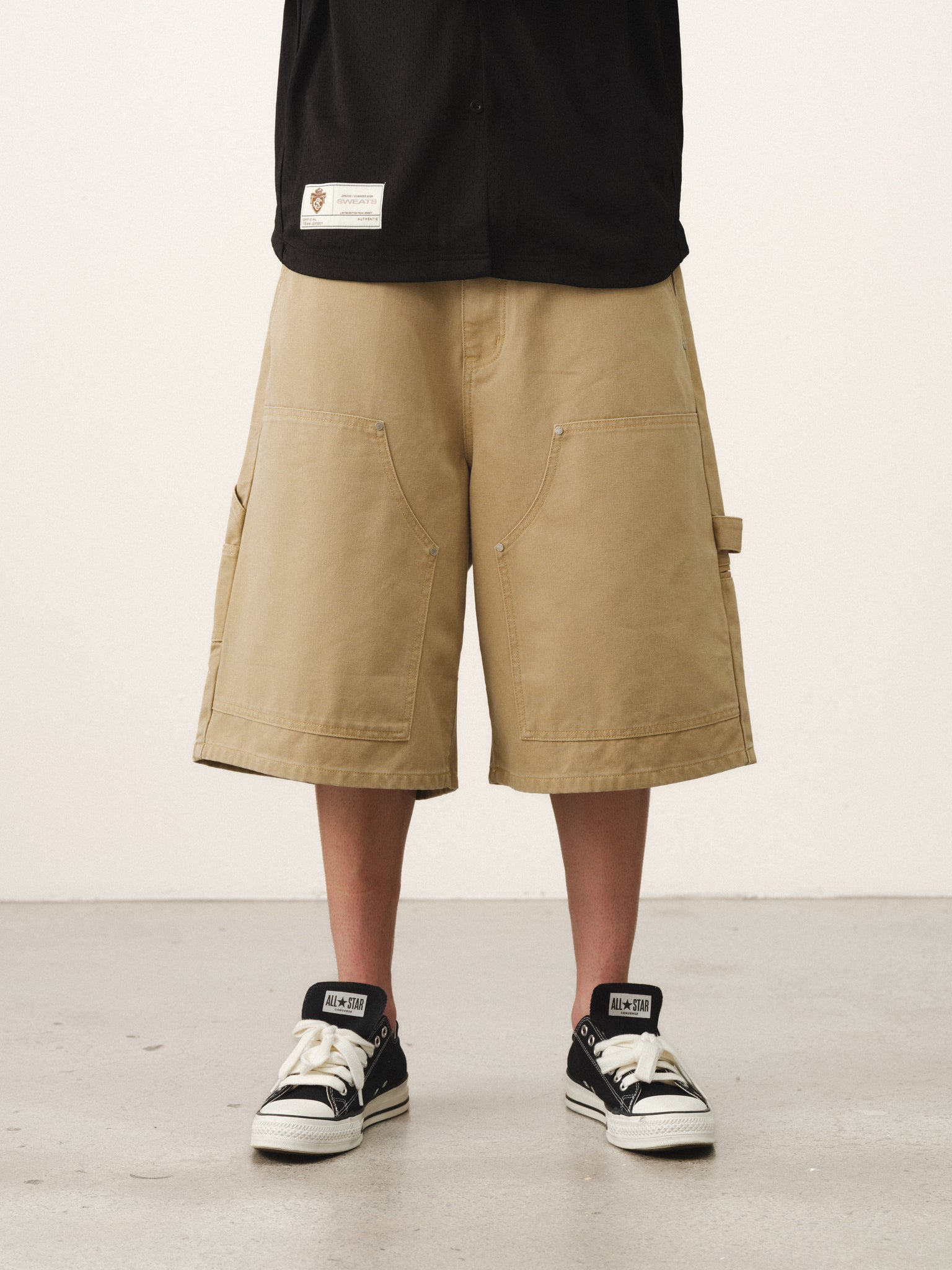 Pair of double knee shorts in sand color from Sweats UK, showcasing casual summer style and durable fabric design.