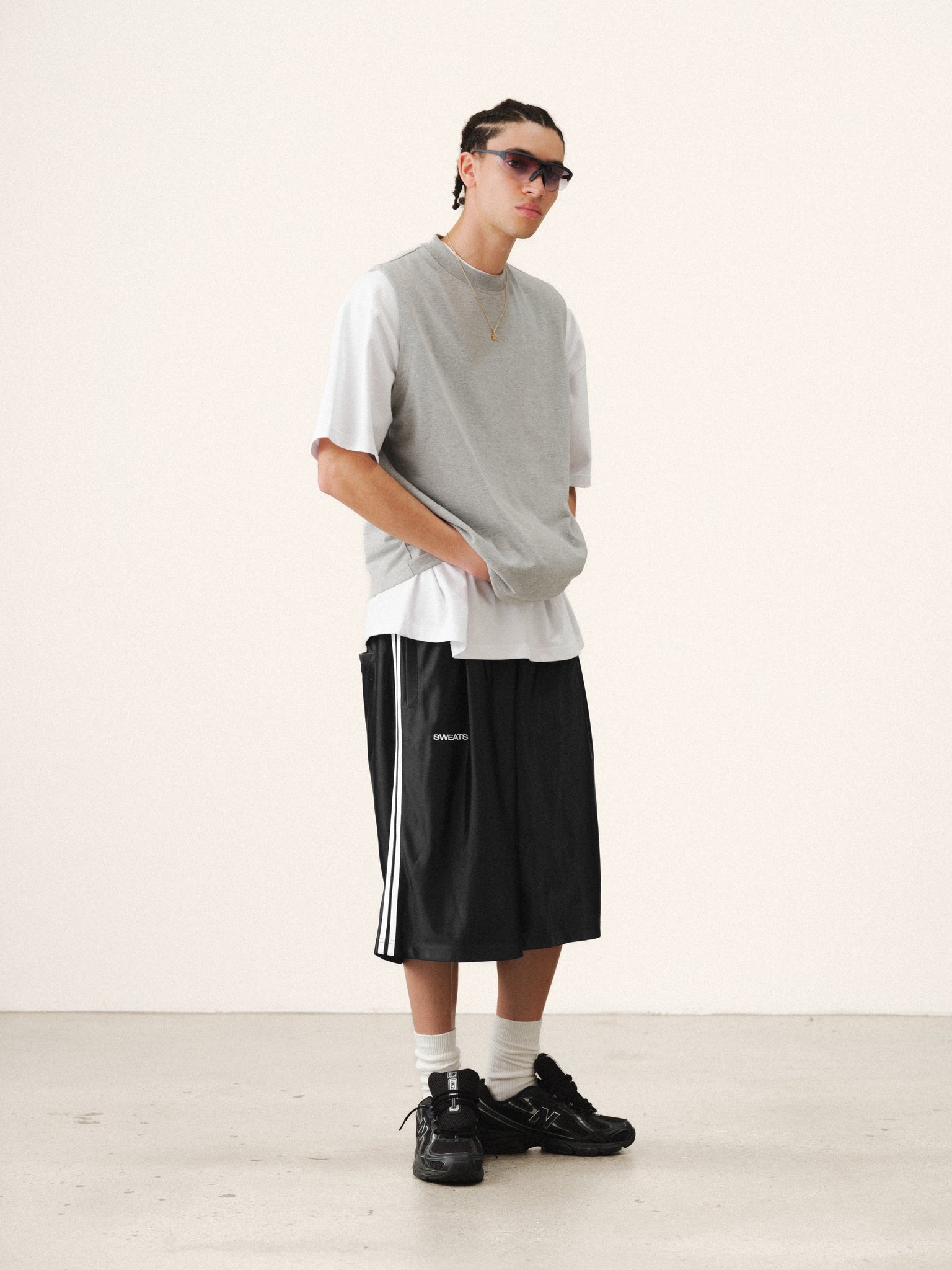 Black League Shorts by Sweats UK displayed on a model, featuring a relaxed fit and casual style for summer wear.