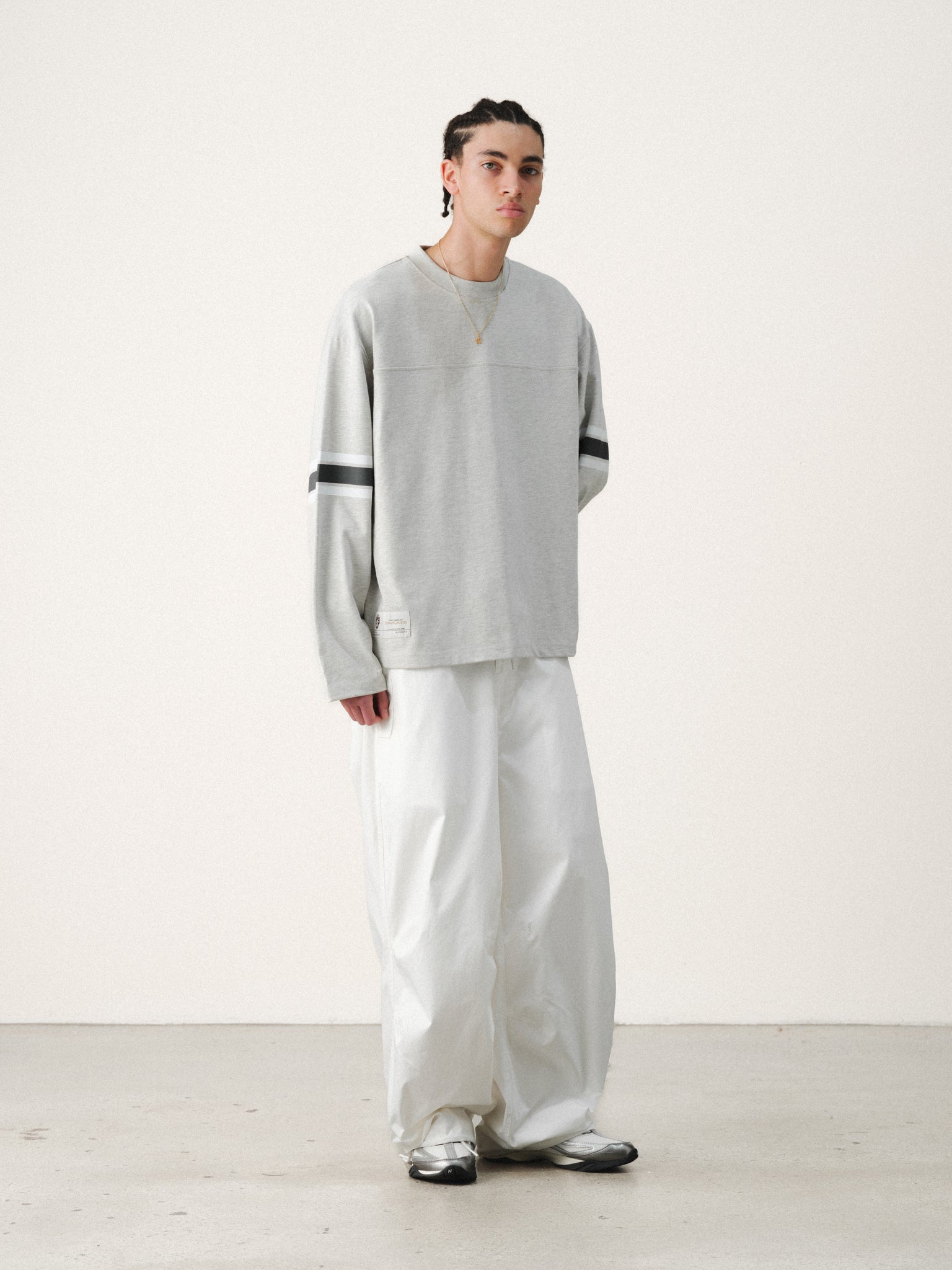 White V3 Flight Pant by Sweats UK, casual athletic pants with a relaxed fit and sporty design displayed on a model.
