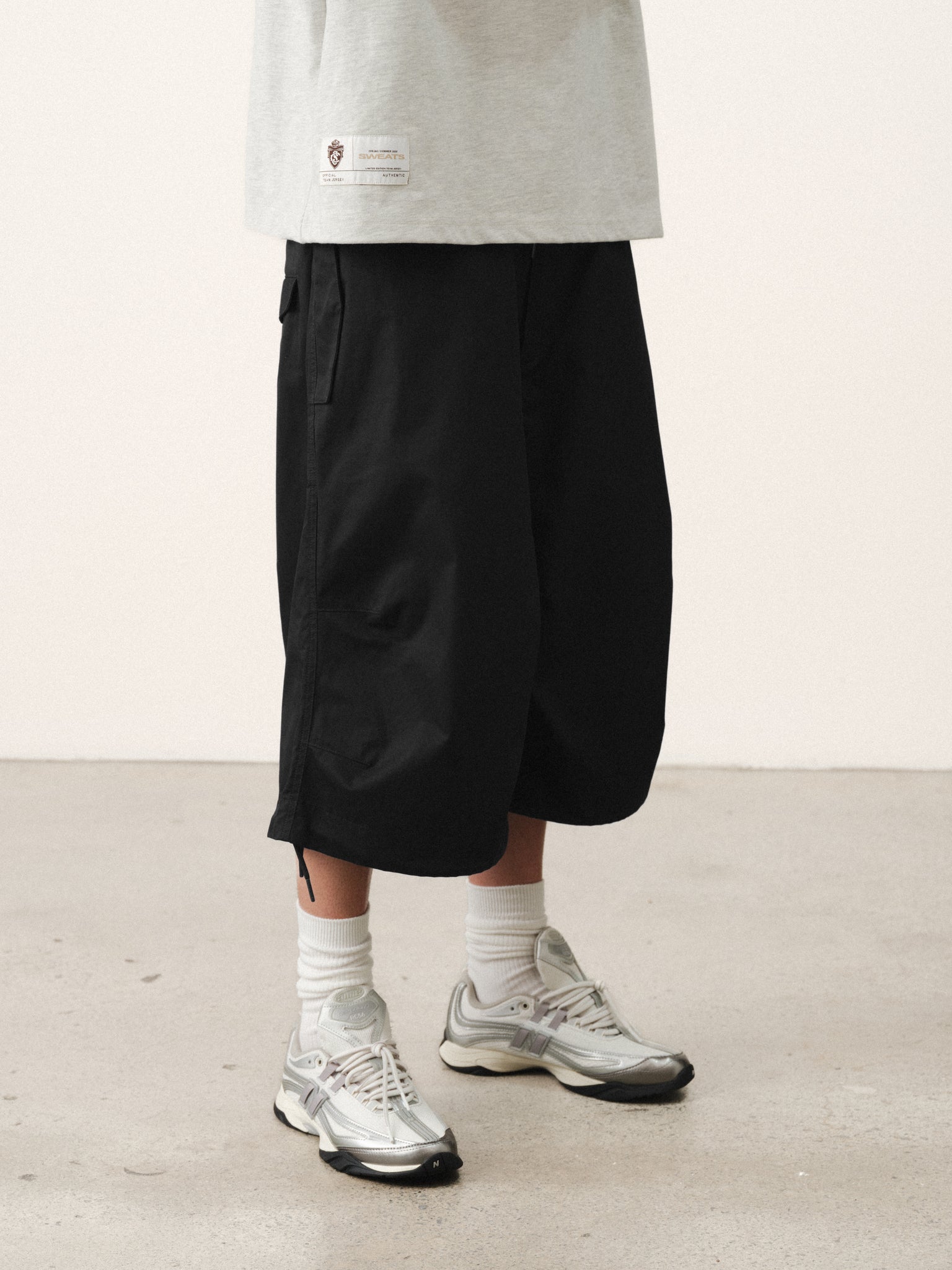 Black V3 Flight Shorts by Sweats UK, showing the lightweight athletic shorts with adjustable waistband and sporty design.
