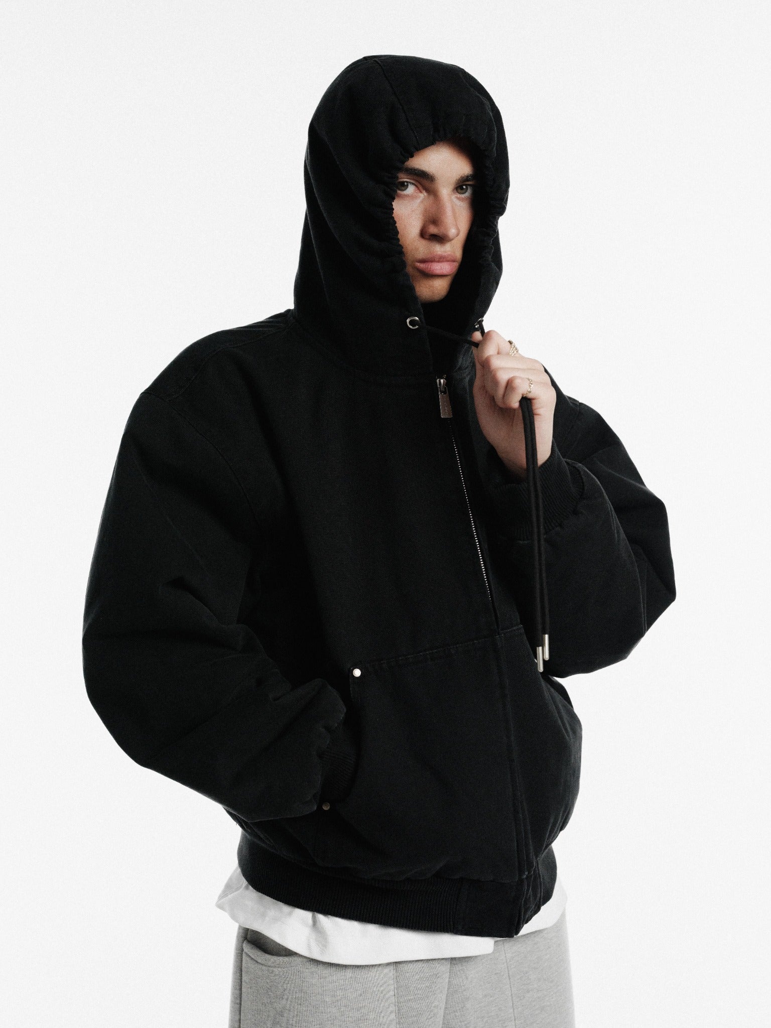 Washed black workwear hoodie from Sweats UK, featuring a comfortable fit and durable fabric for industrial or casual wear.