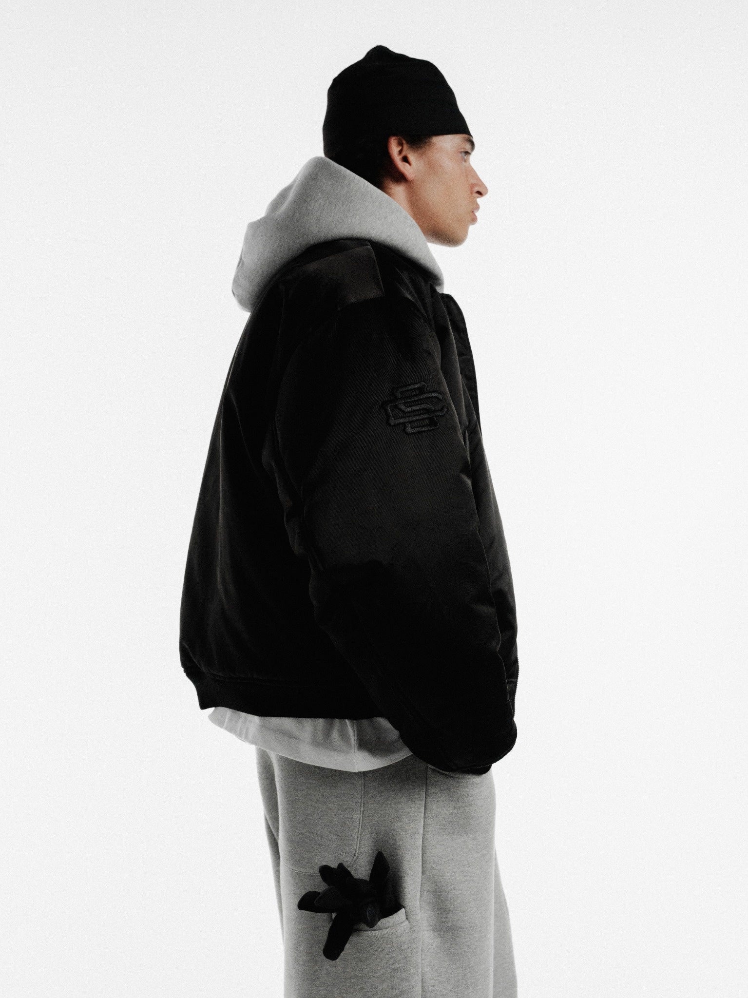 Black bomber jacket from Sweats UK featuring a classic zip front and ribbed cuffs, stylish winter outerwear.