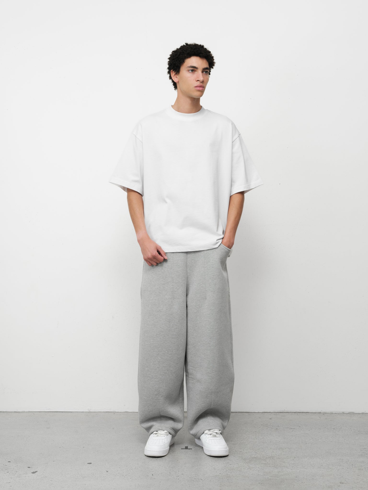 Pure white Signature blank T-shirt from Sweats UK, displayed flat with visible crew neckline and short sleeves.