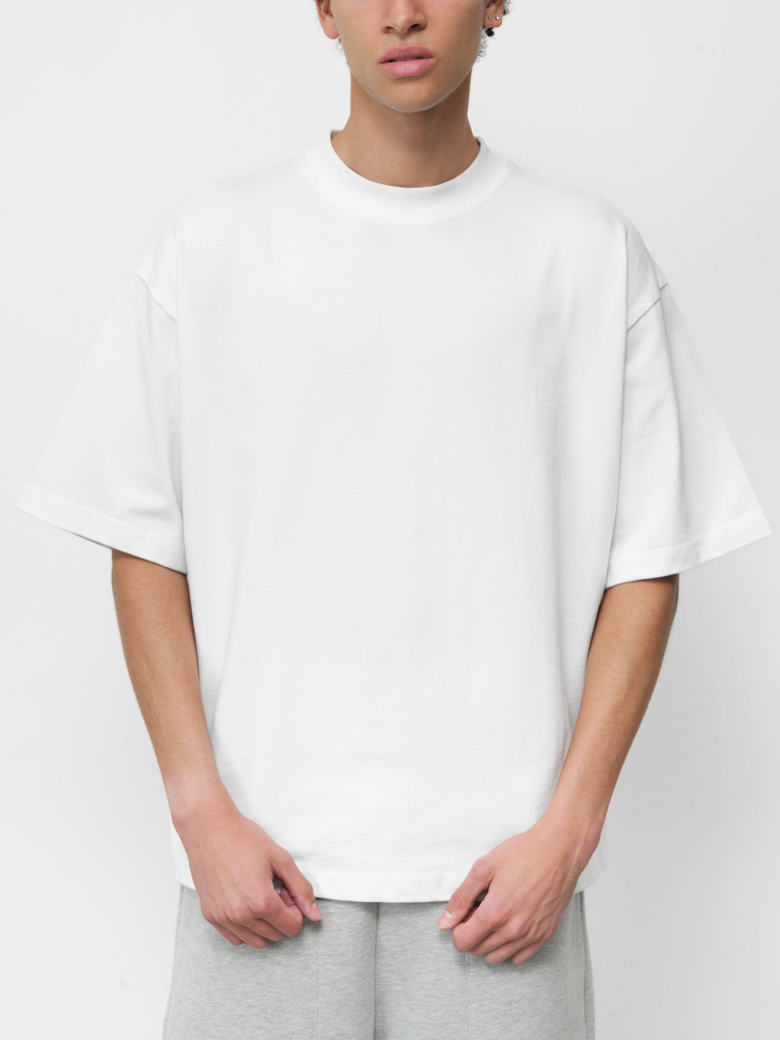 Pure white SIGNATURE BLANK T-shirt by Sweats UK displayed on a plain background.