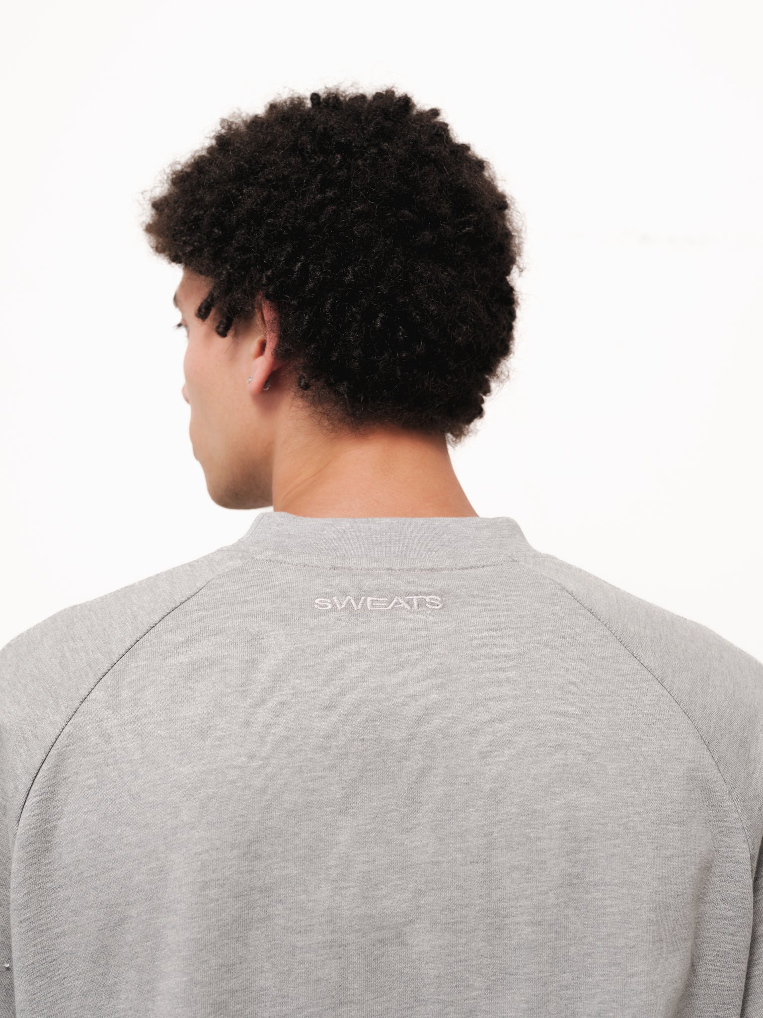 Grey long sleeve T-shirt from Sweats UK, displayed flat with visible soft fabric and classic crew neckline.