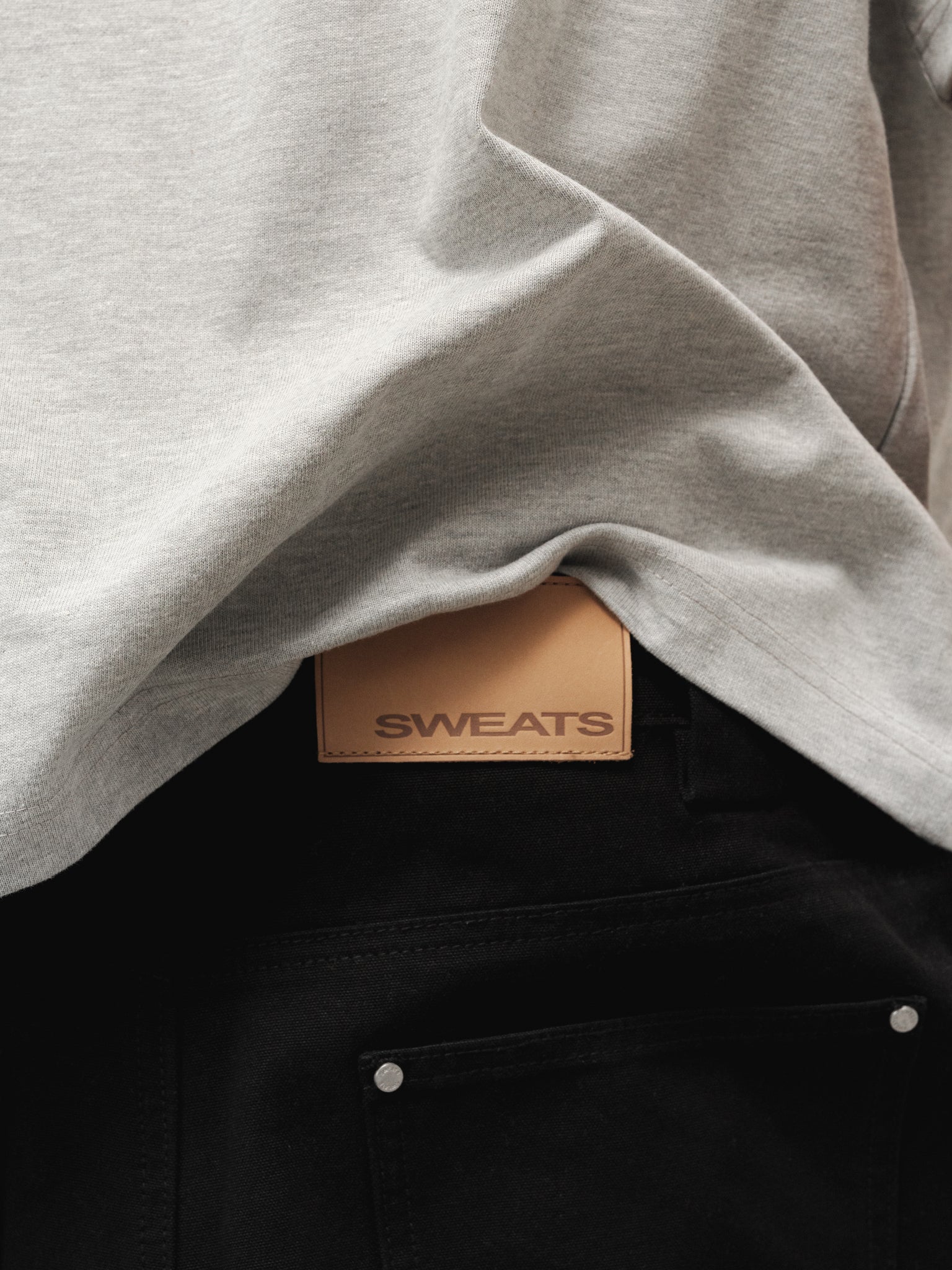 Black workwear pant from Sweats UK, full-length view showing durable fabric and classic fit for industrial or casual wear.