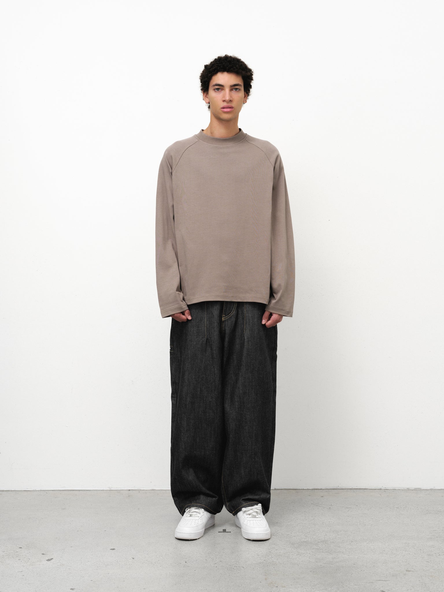 Long sleeve Dust T-shirt by Sweats UK displayed on a model, showcasing its casual fit and soft fabric.