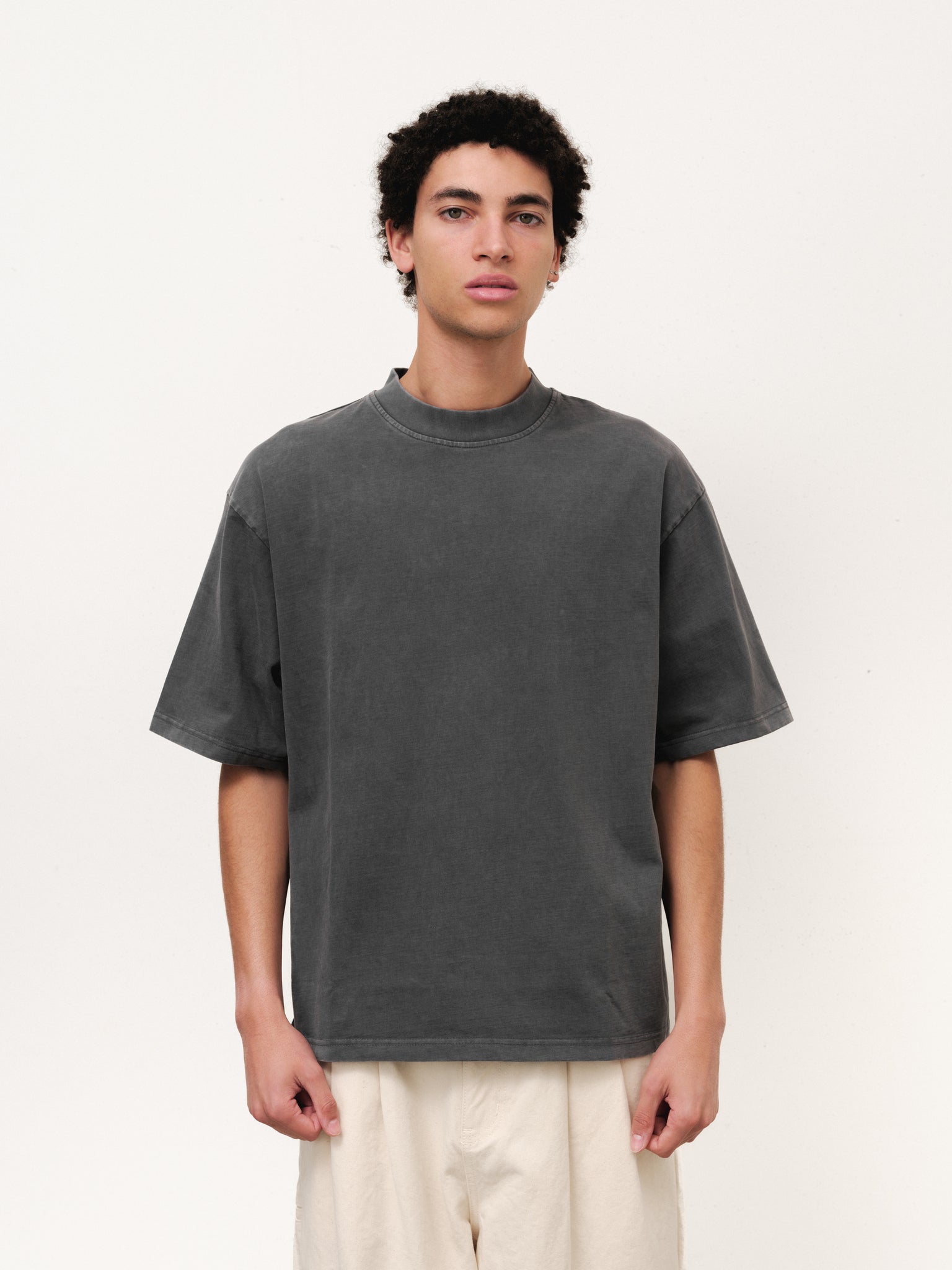 Washed grey Signature Blank T-shirt by Sweats UK displayed on a hanger with a neutral background.