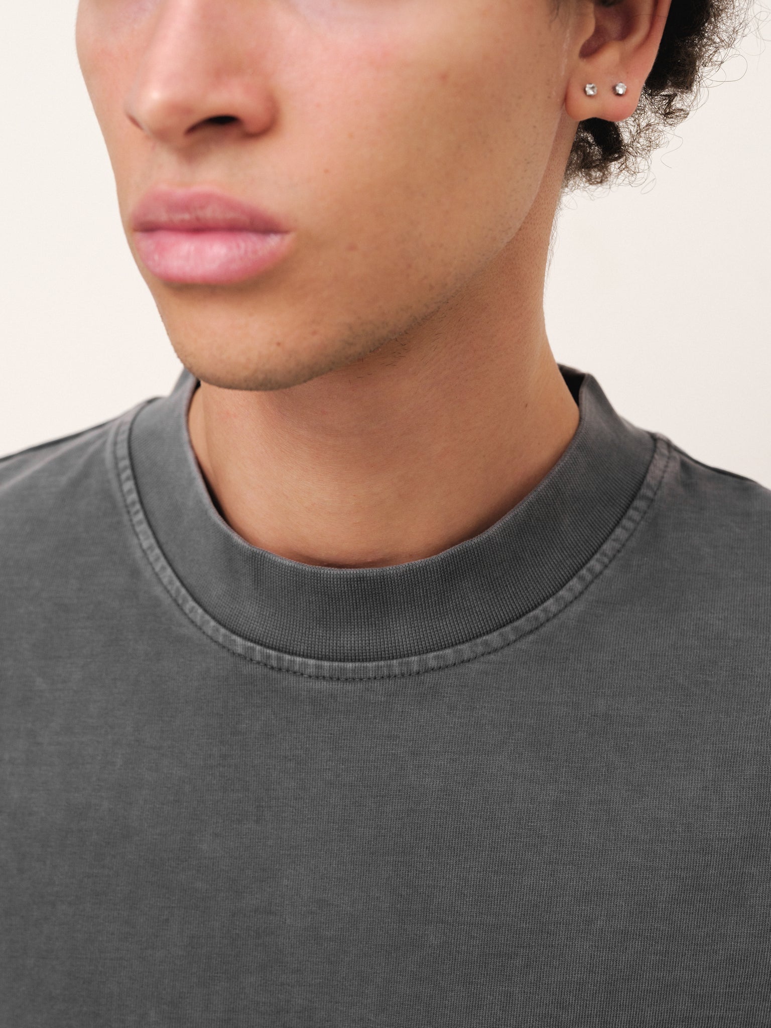 Washed grey Signature Blank T-shirt by Sweats UK displayed on a mannequin, showing front view with soft fabric texture.