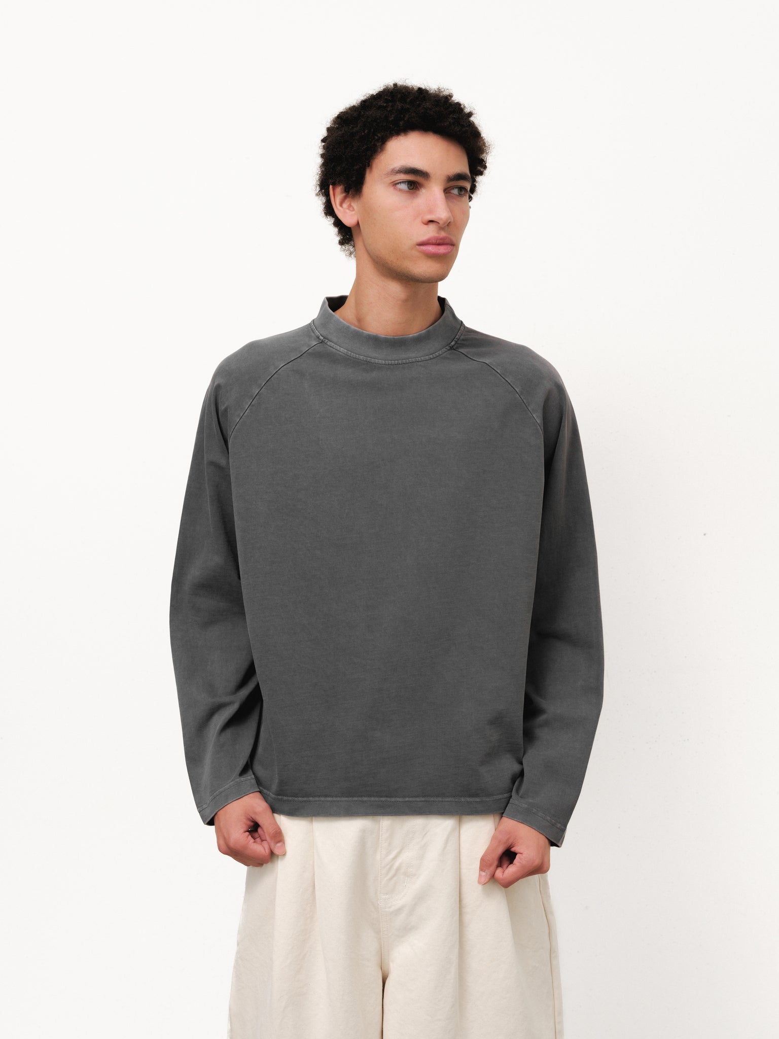 Washed grey long sleeve T-shirt by Sweats UK, displayed on a hanger in a full stock shoot.