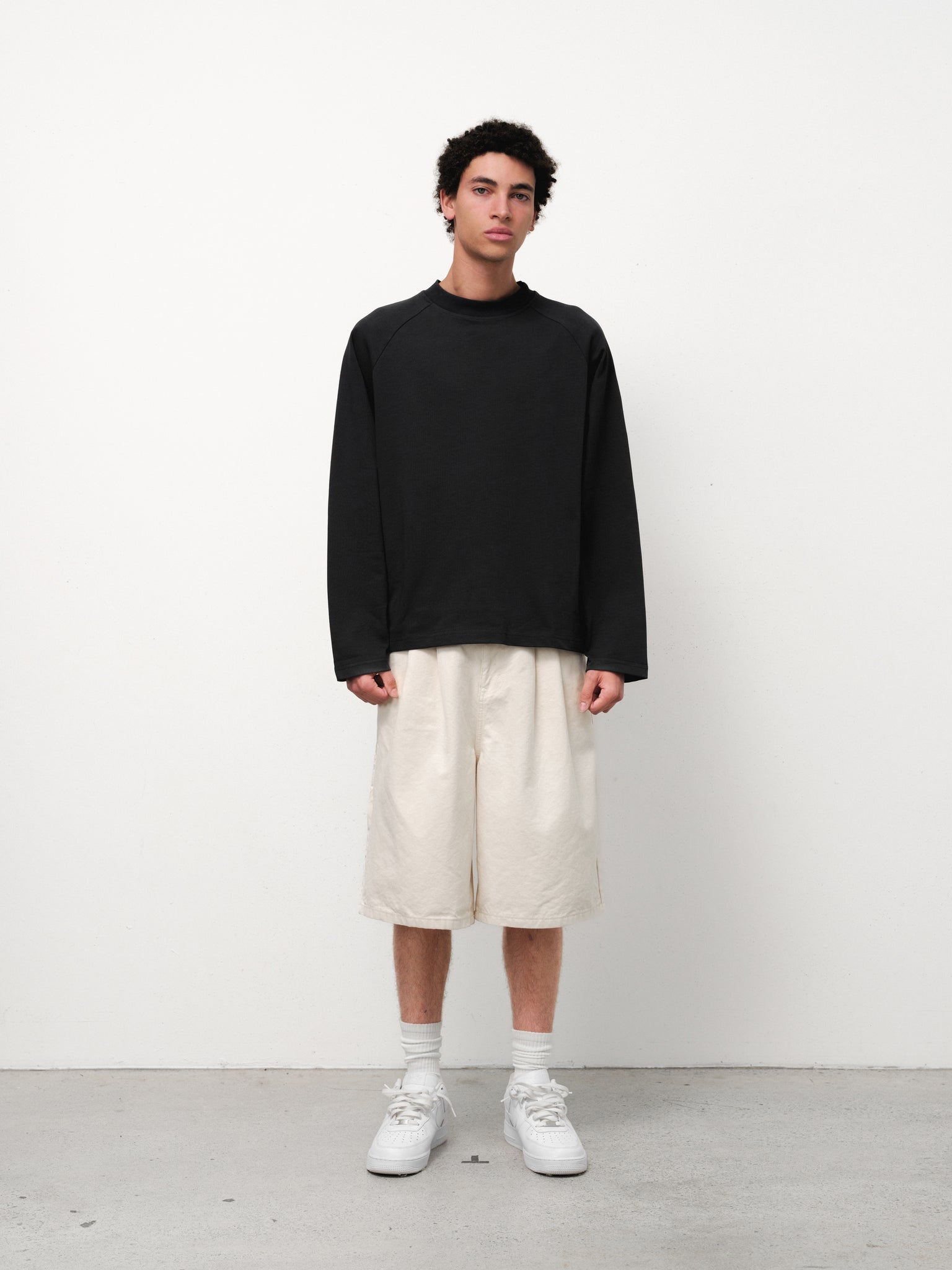Ecru workwear shorts from Sweats UK displayed on a model, featuring durable fabric and practical design for work environments.