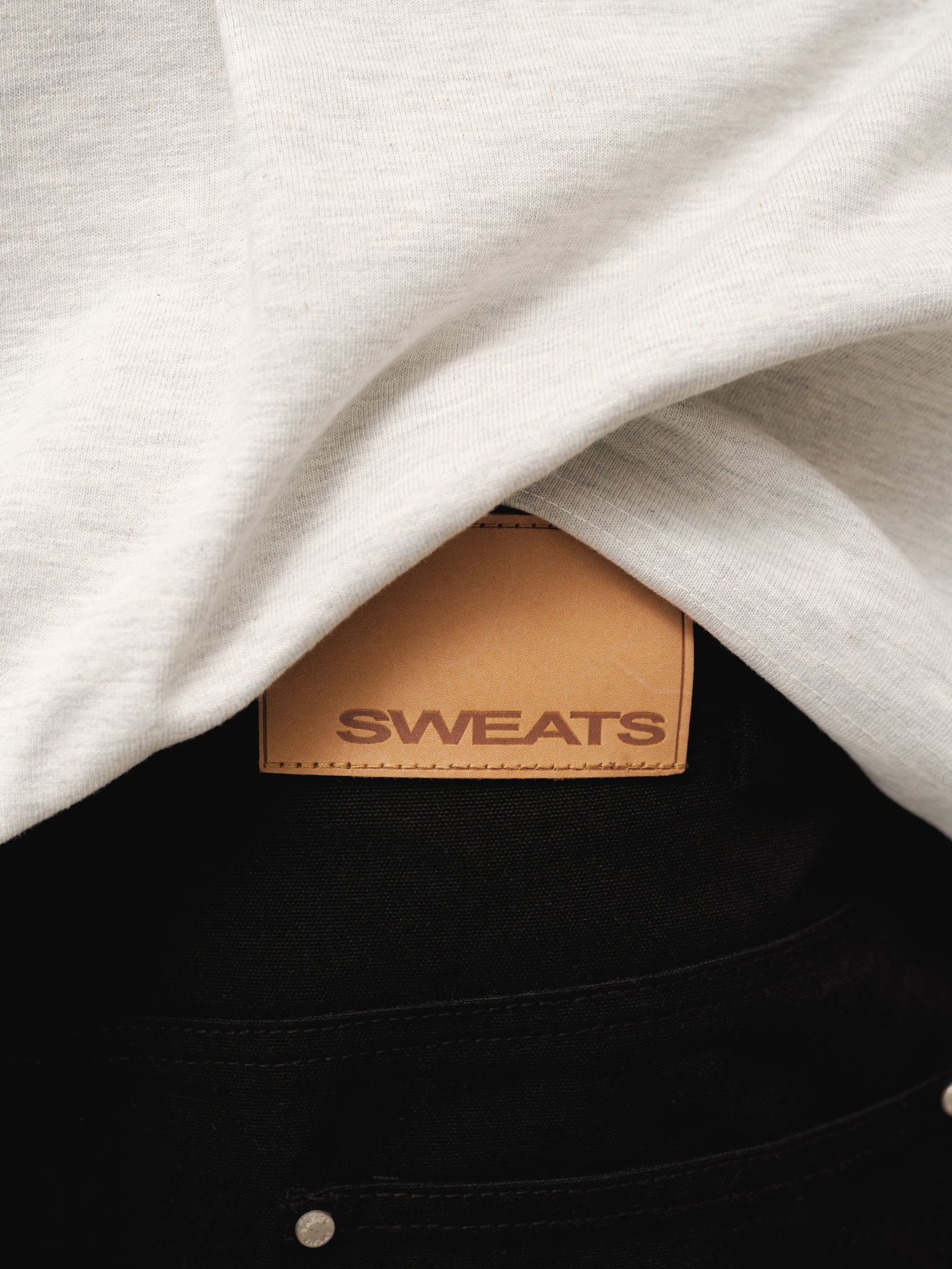 Black workwear shorts by Sweats UK, featuring durable fabric and practical design, suitable for industrial or casual work environments.