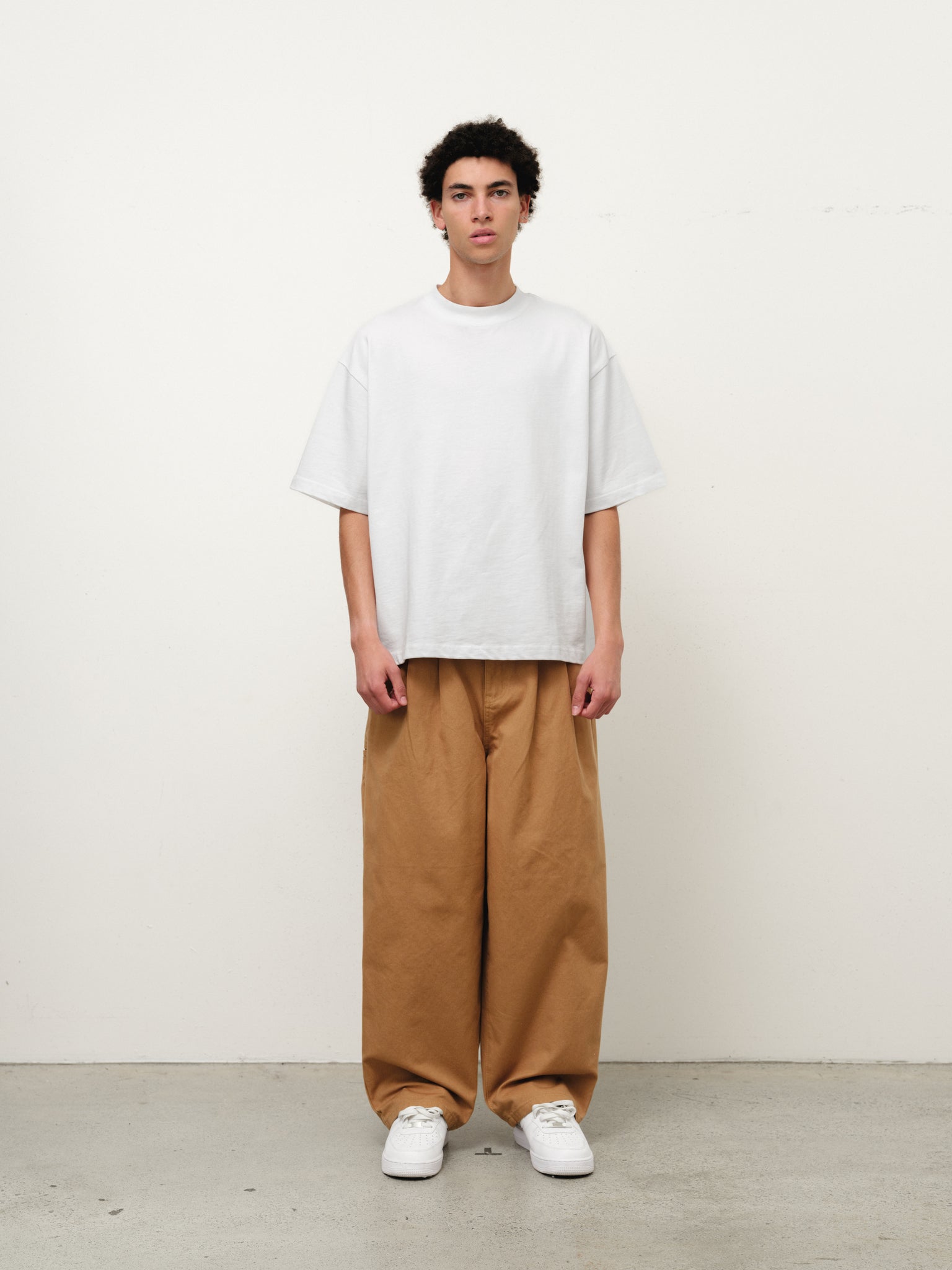 Tan workwear pants from Sweats UK, shown in a full stock shoot image. Durable, comfortable workwear for industrial or construction use.