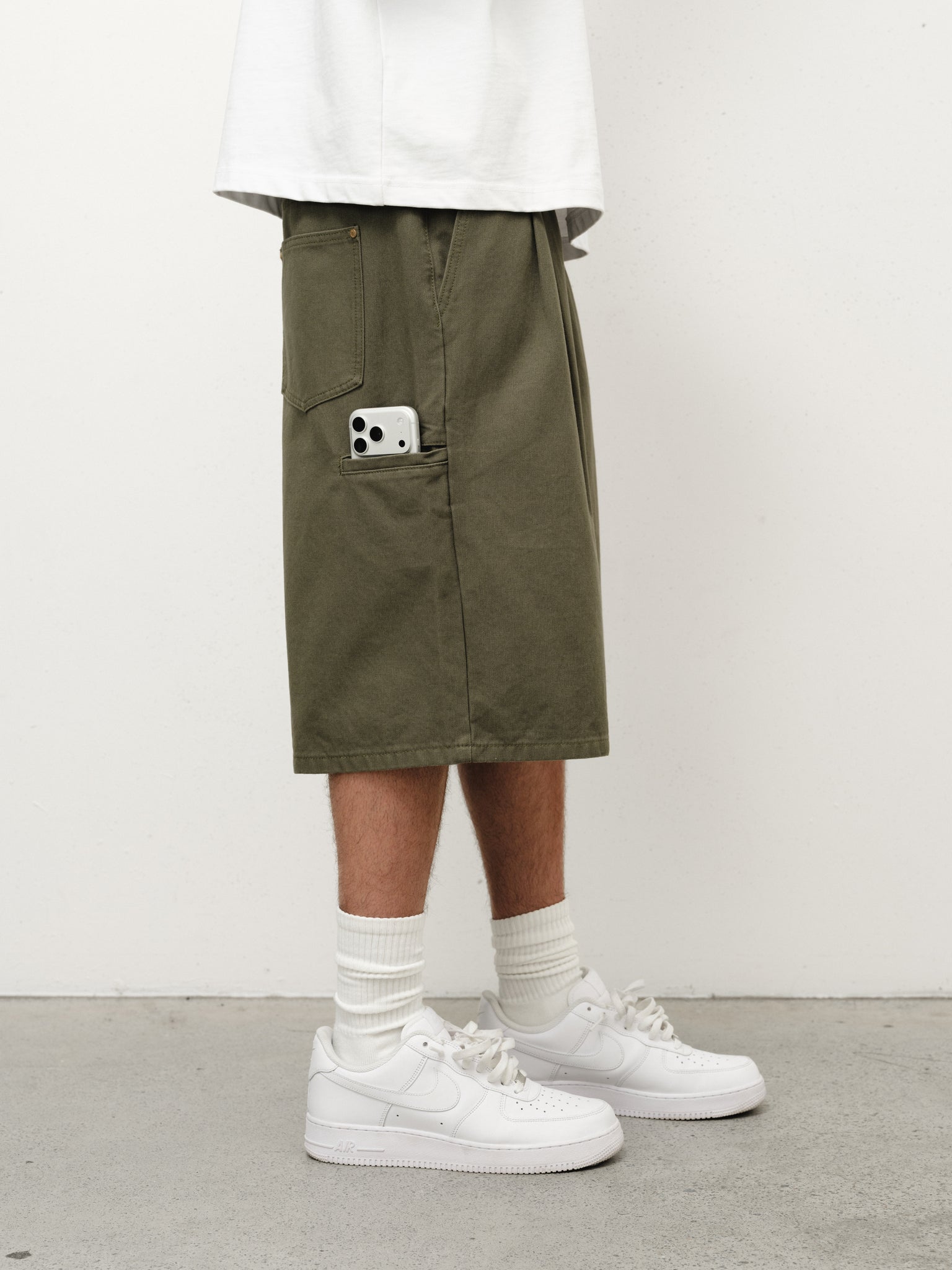Olive workwear shorts from Sweats UK, featuring durable fabric and practical design for industrial or casual use.